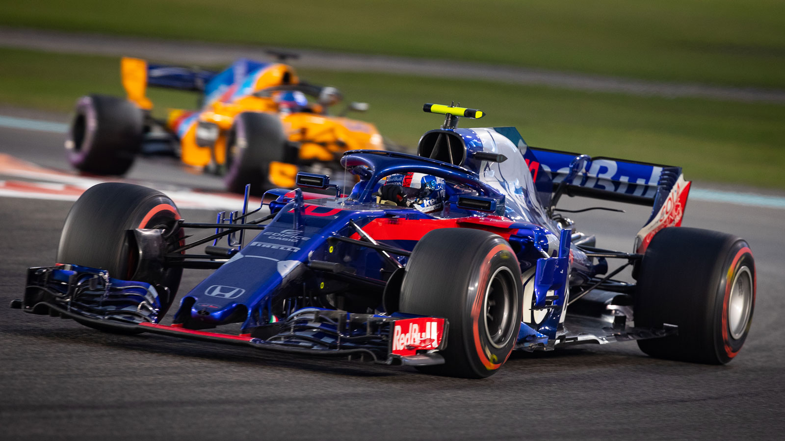 A photo of Pierre Gasly driving his Toro Rosso F1 car. 