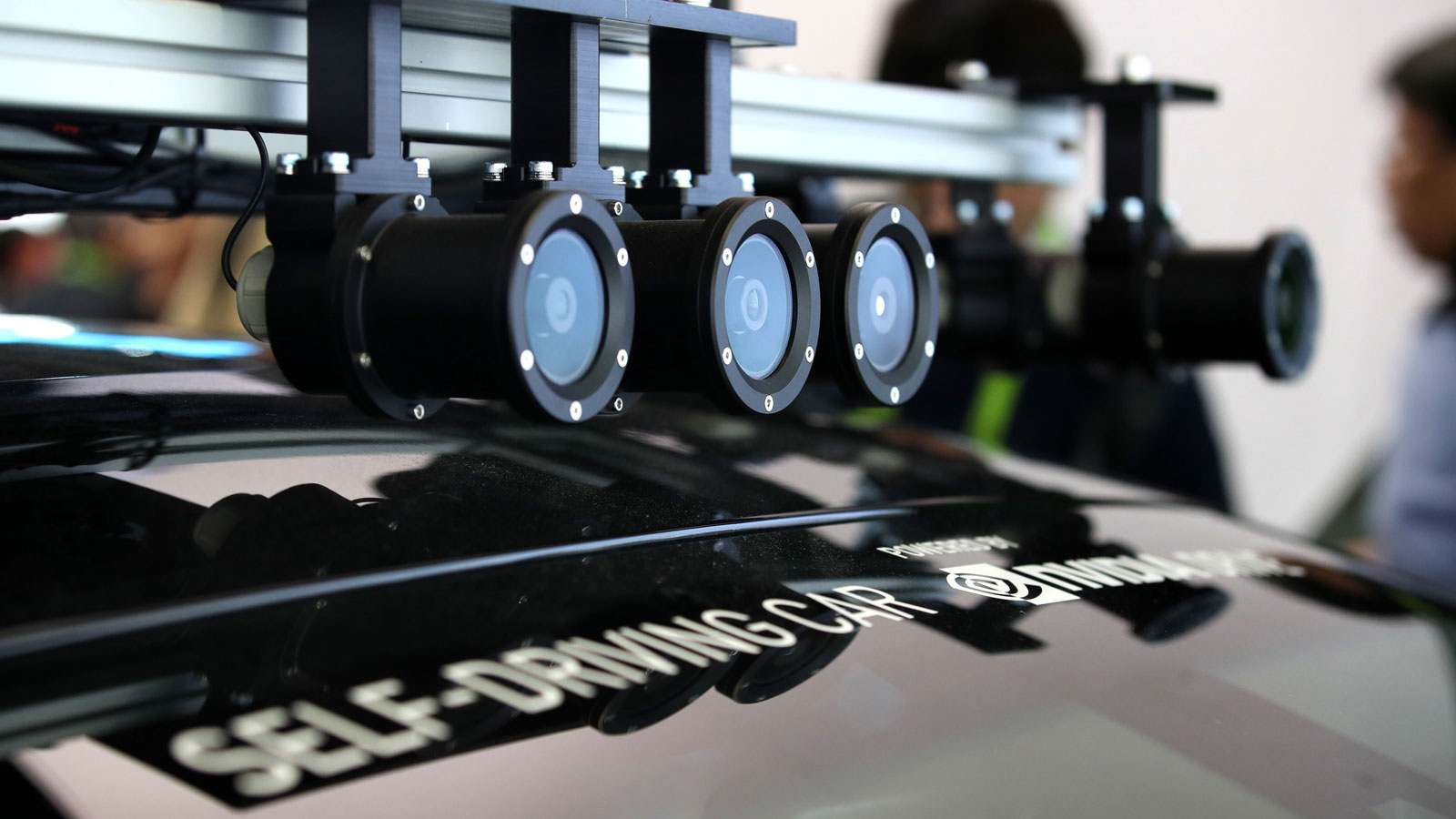 A photo of the camera array on the top of an electric car. 