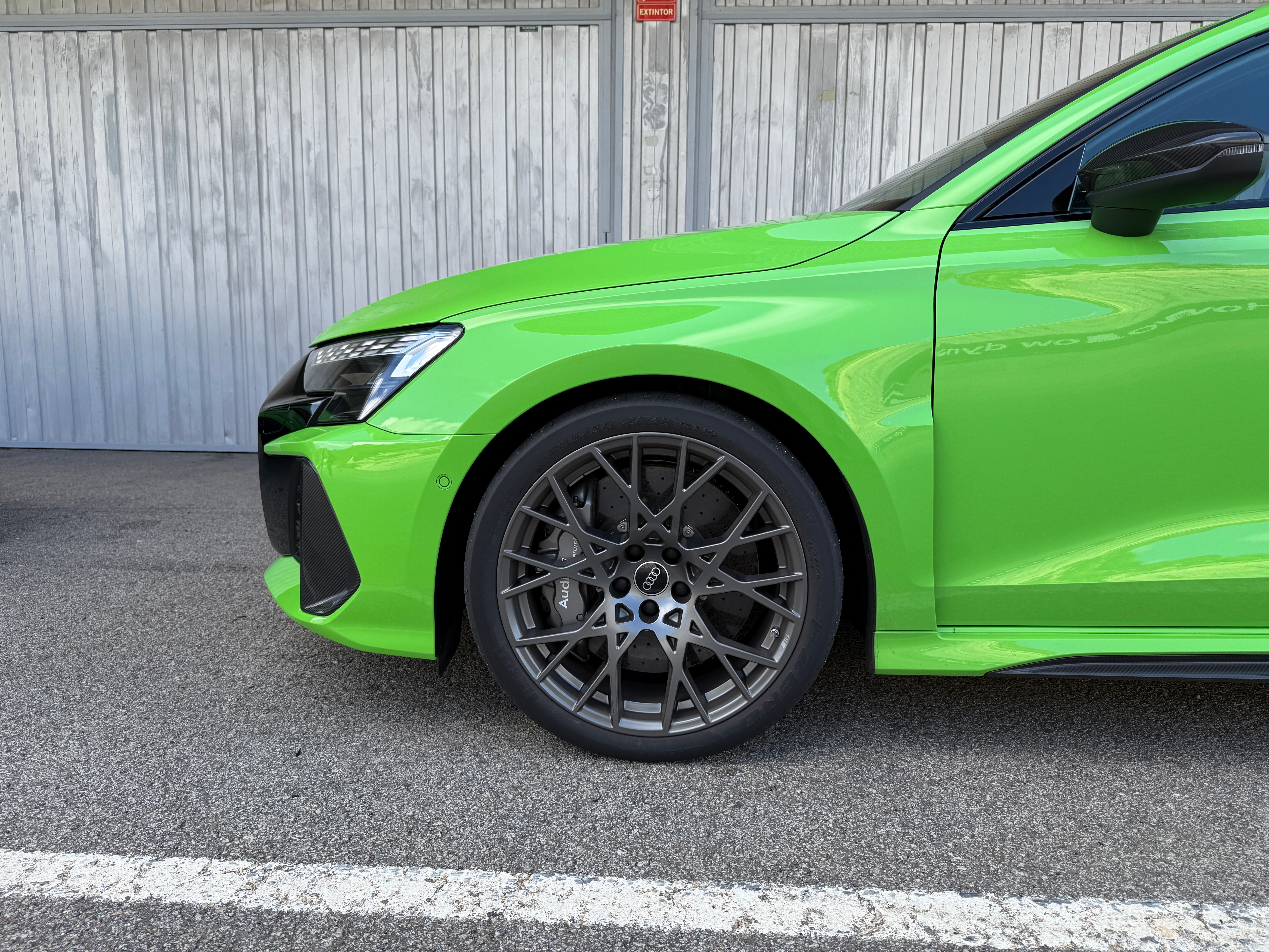 Front wheel of a green 2025 Audi RS3 Sportback