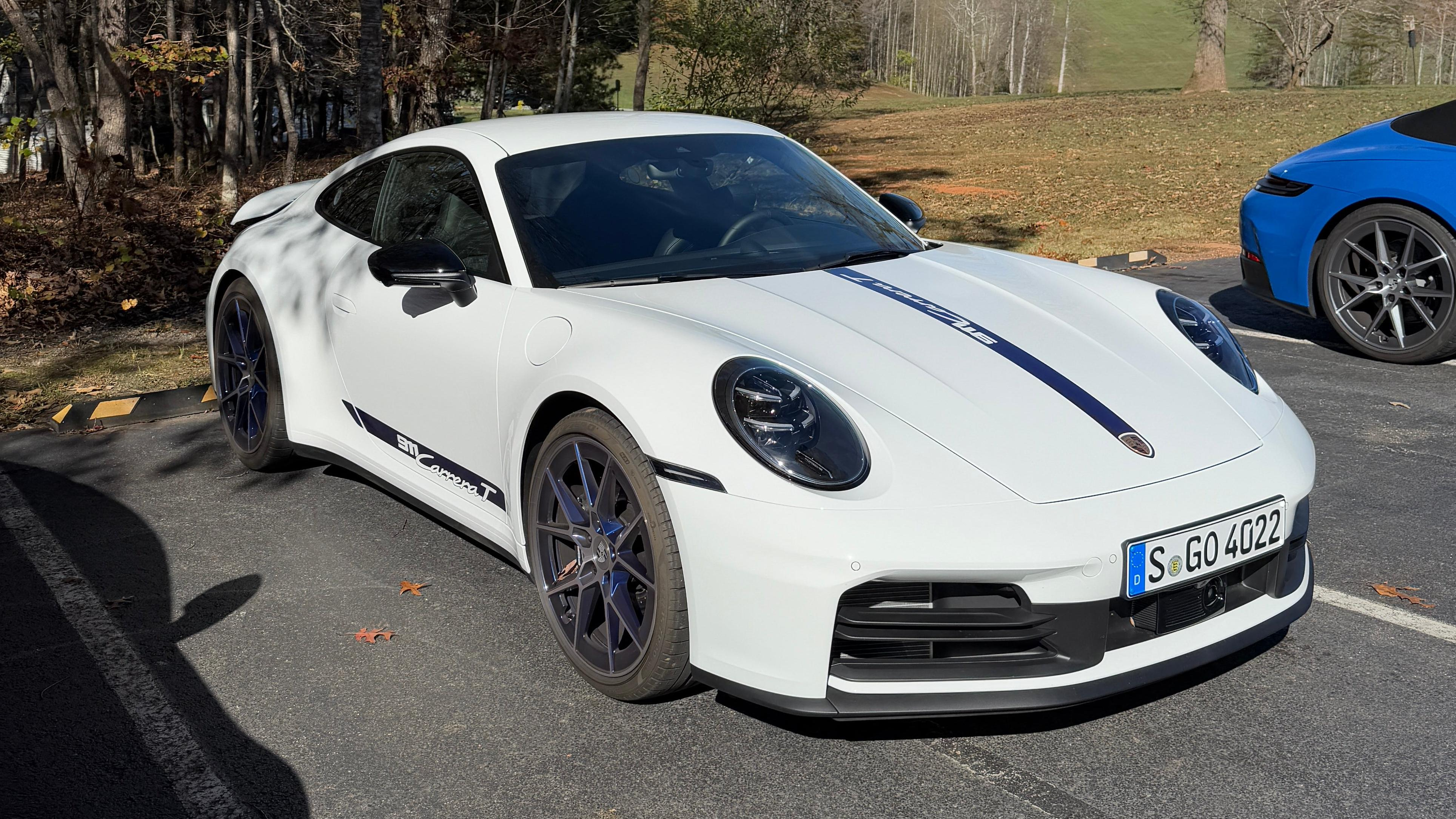 Front 3/4 view of a white 2025 Porsche 911 Carrera T