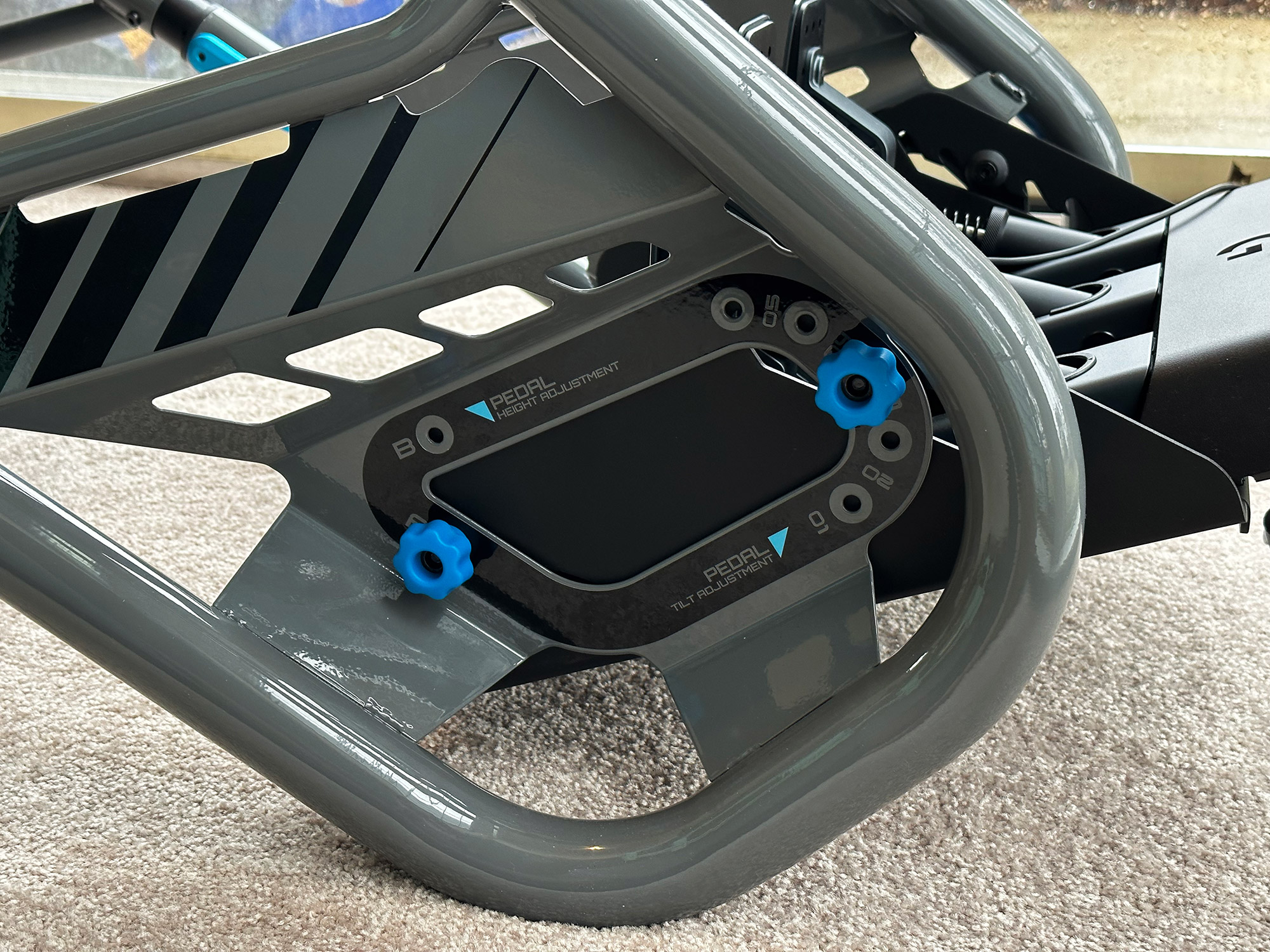 Close-up view of the pedal plate adjustments on the Playseat Trophy Logitech G Edition.