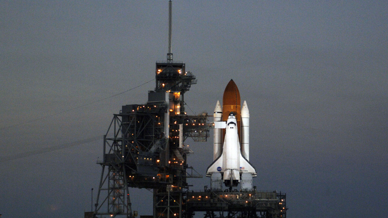 A photo of NASA's Space Shuttle on a launch pad. 