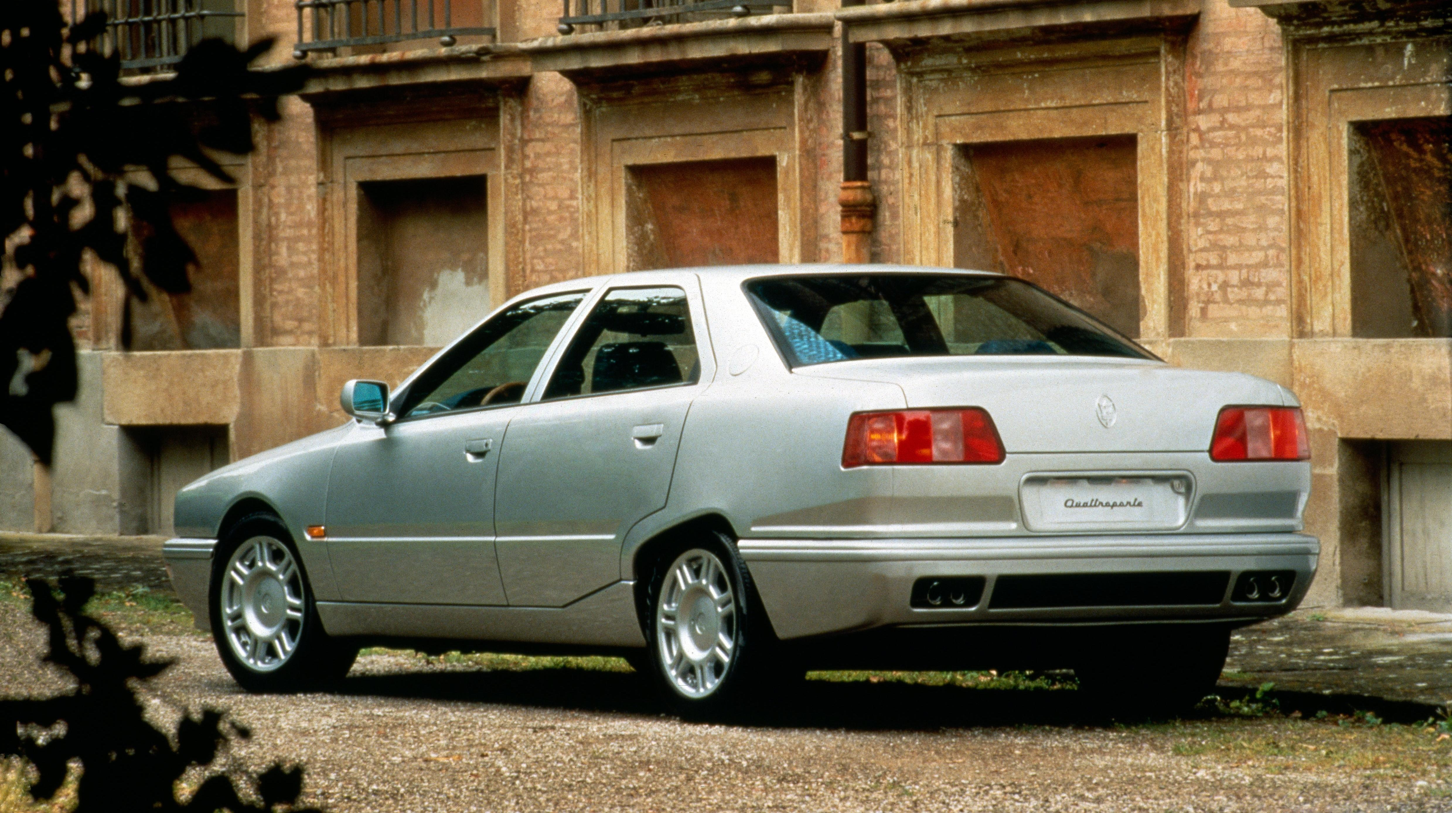 Rear 3/4 view of a silver Maserati Quattroporte IV