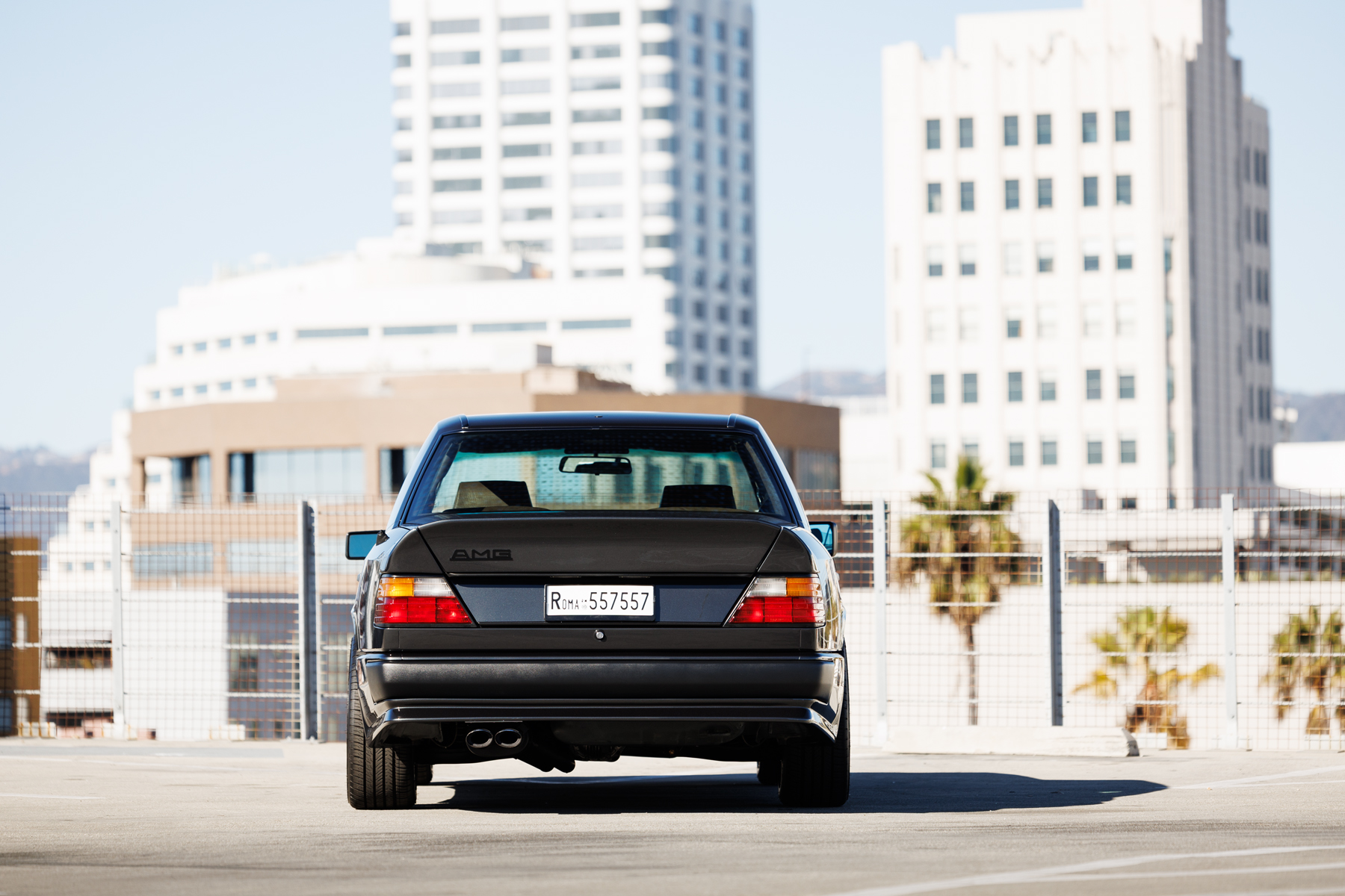 Rear view of a black Mercedes-Benz AMG 300E 6.0 Hammer