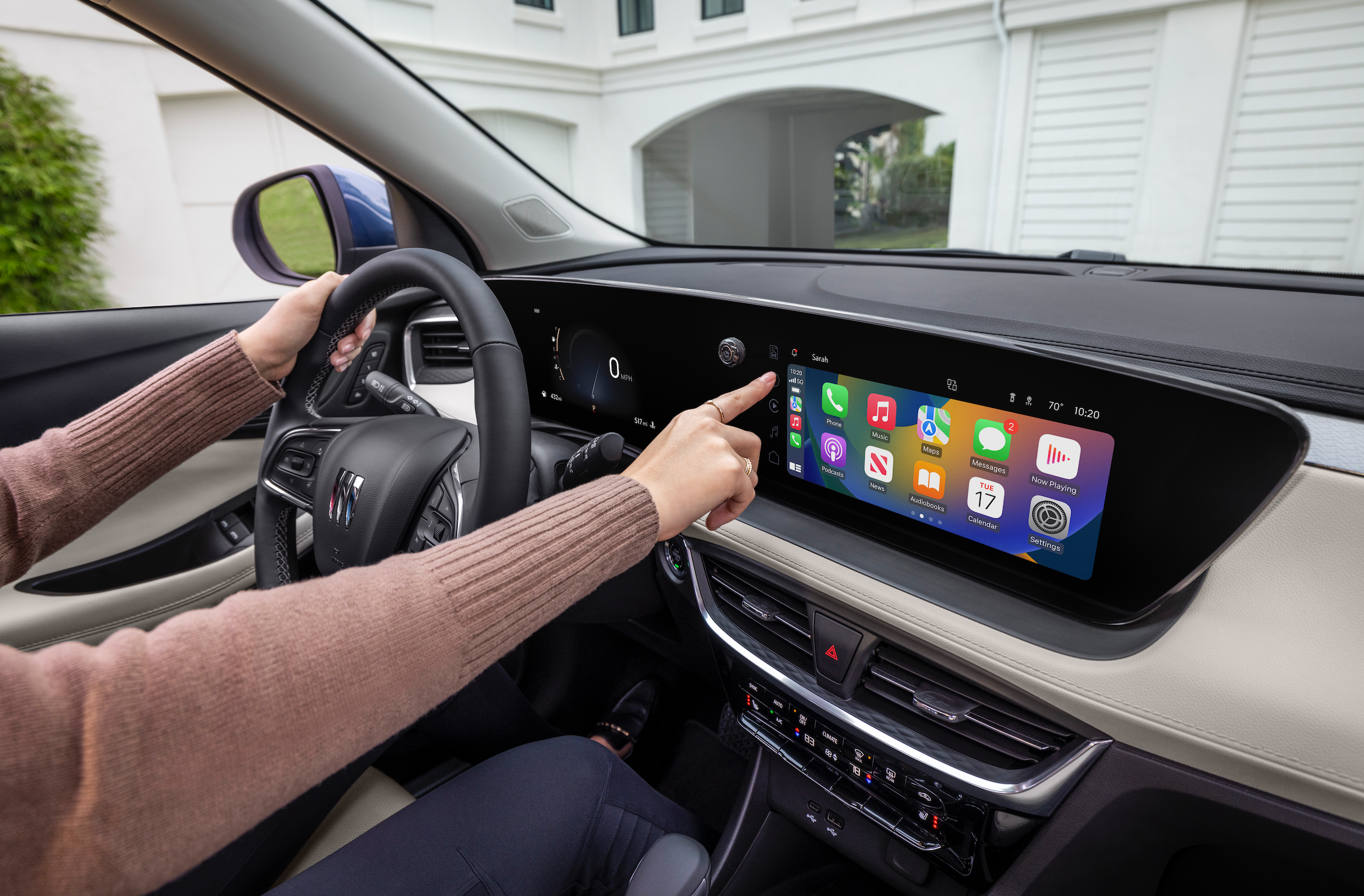 A blue 2024 Buick Encore GX Avenir.