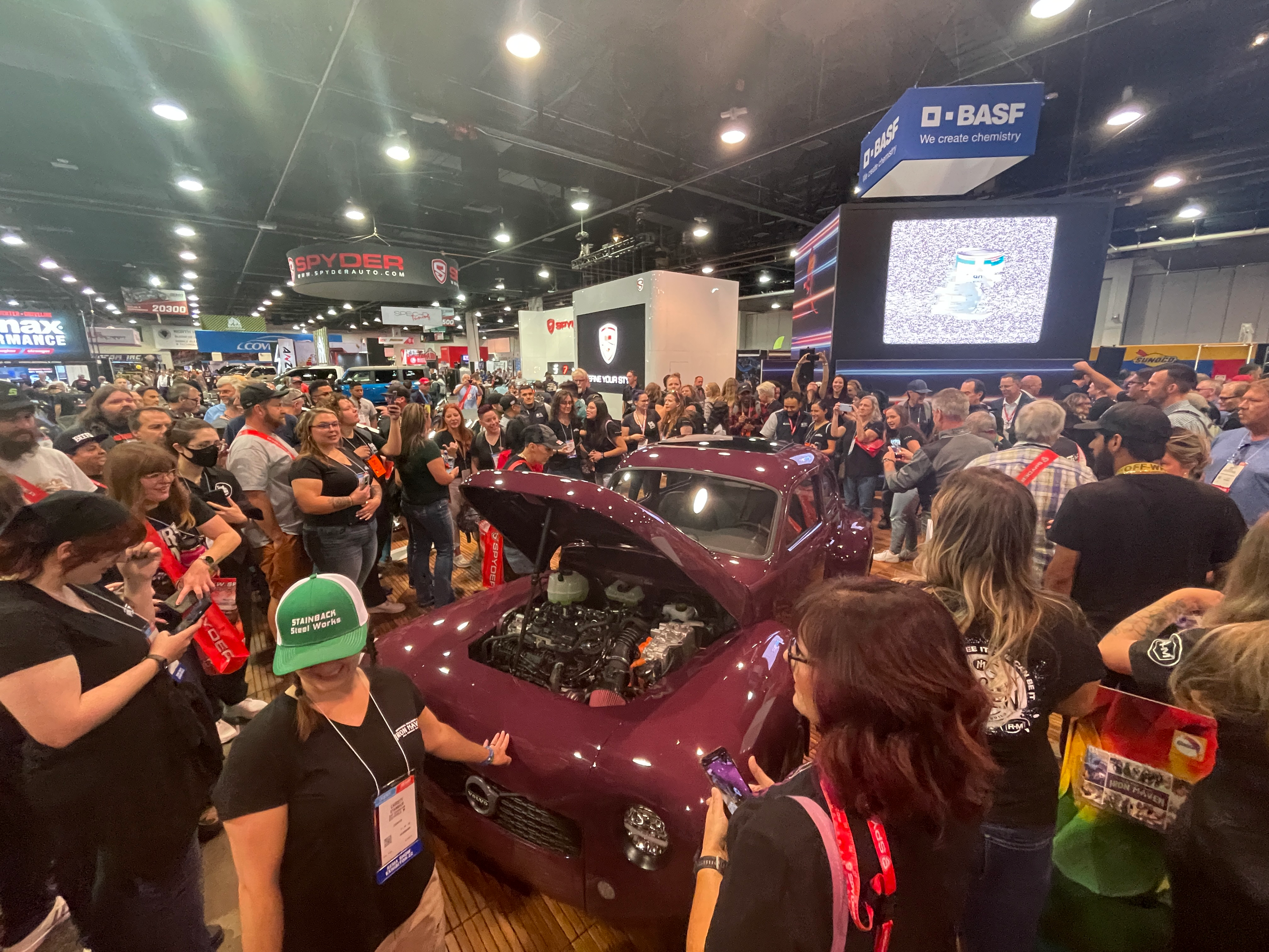 Large crowd surrounds Iron Maven Volvo build at the BASF booth at SEMA 