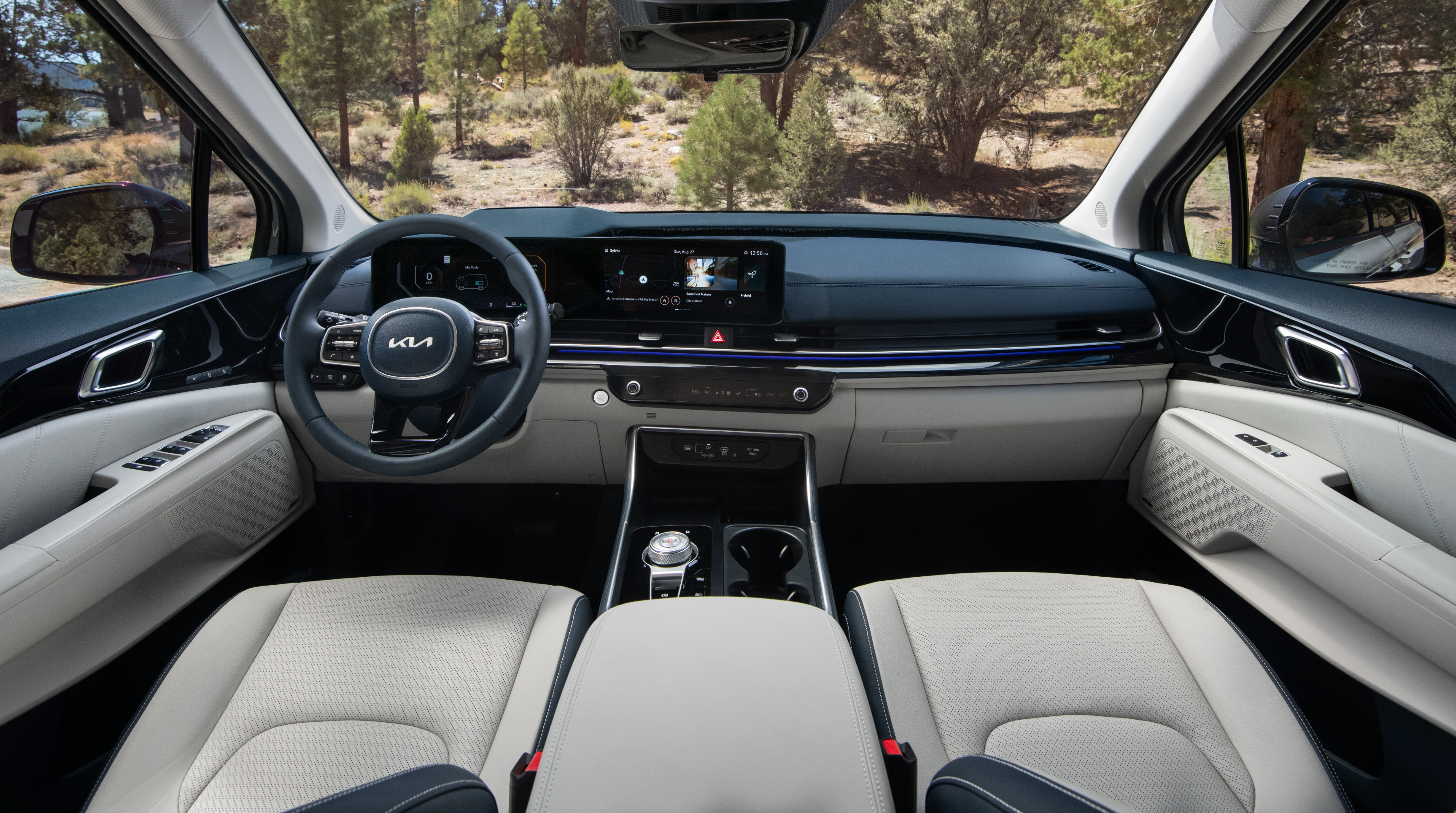 White and blue interior of a 2025 Kia Carnival minivan