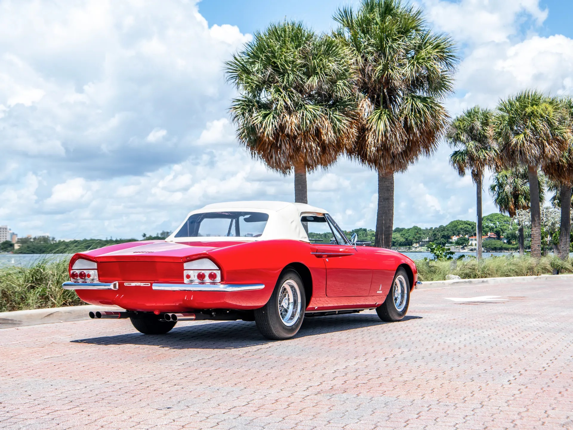 Rear 3/4 view of a red 1967 Ferrari 365 California Spyder