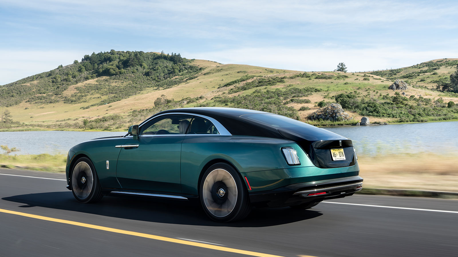 A photo of the rear quarter on an electric Rolls Royce Spectre. 