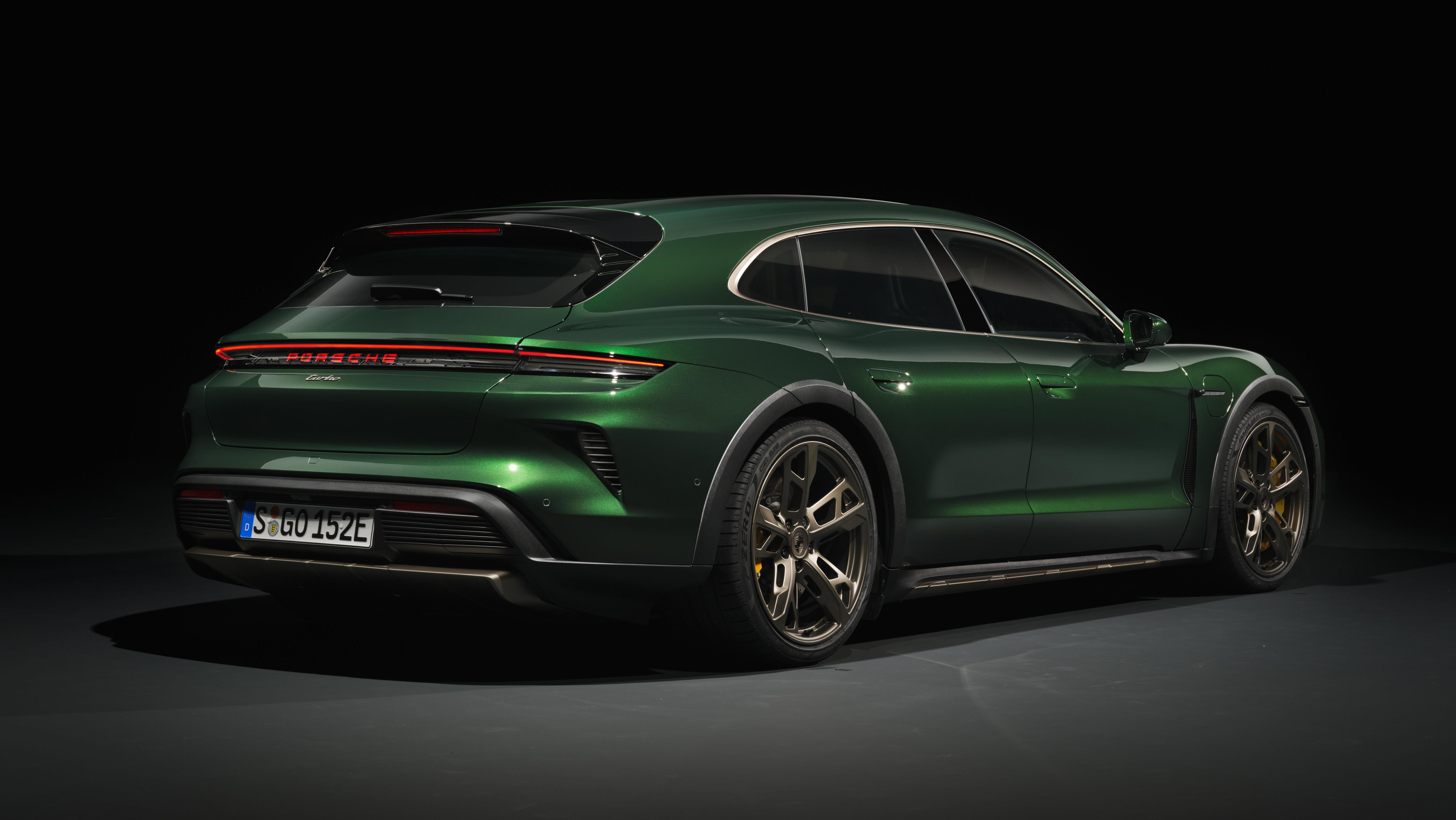 Rear 3/4 view of a green 2025 Porsche Taycan Cross Turismo