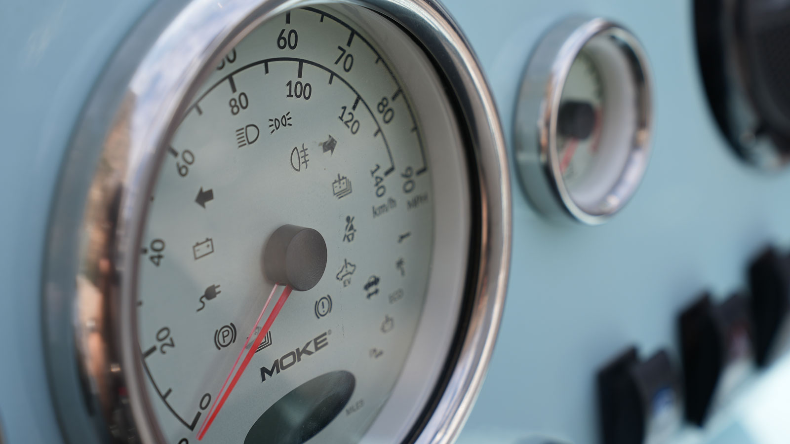 A photo of the speedometer on a Moke EV. 