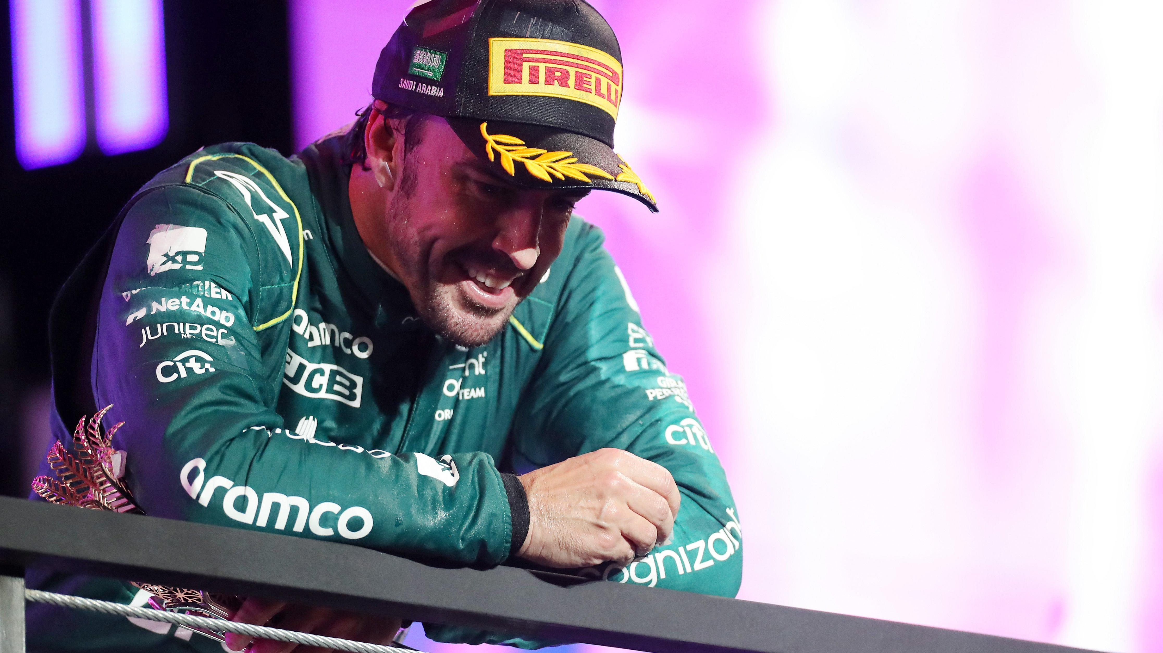 Third placed Fernando Alonso of Spain and Aston Martin F1 Team celebrates on the podium during the F1 Grand Prix of Saudi Arabia at Jeddah Corniche Circuit on March 19, 2023 in Jeddah, Saudi Arabia.