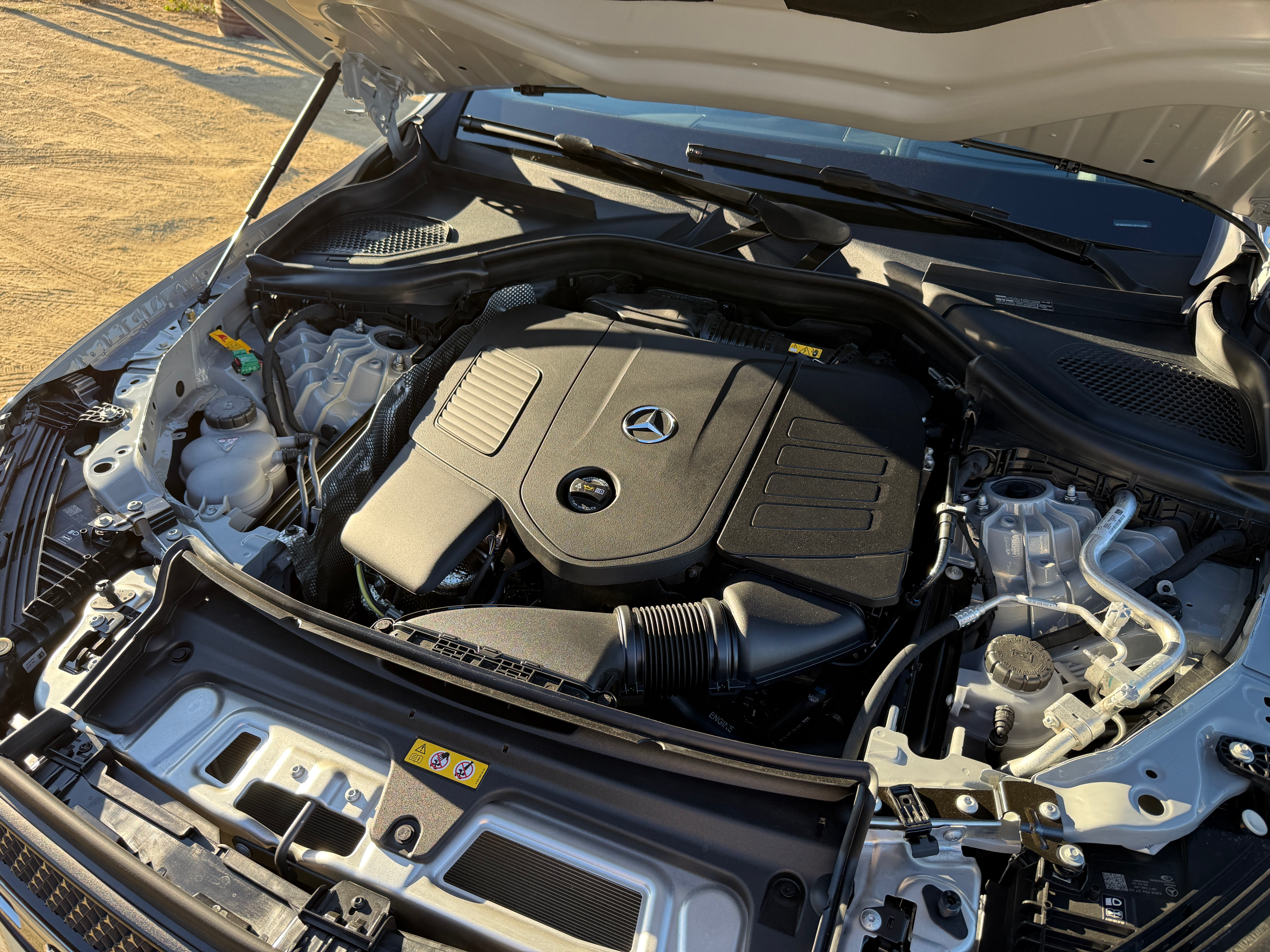 Engine bay of a grey 2025 Mercedes-Benz GLC350e