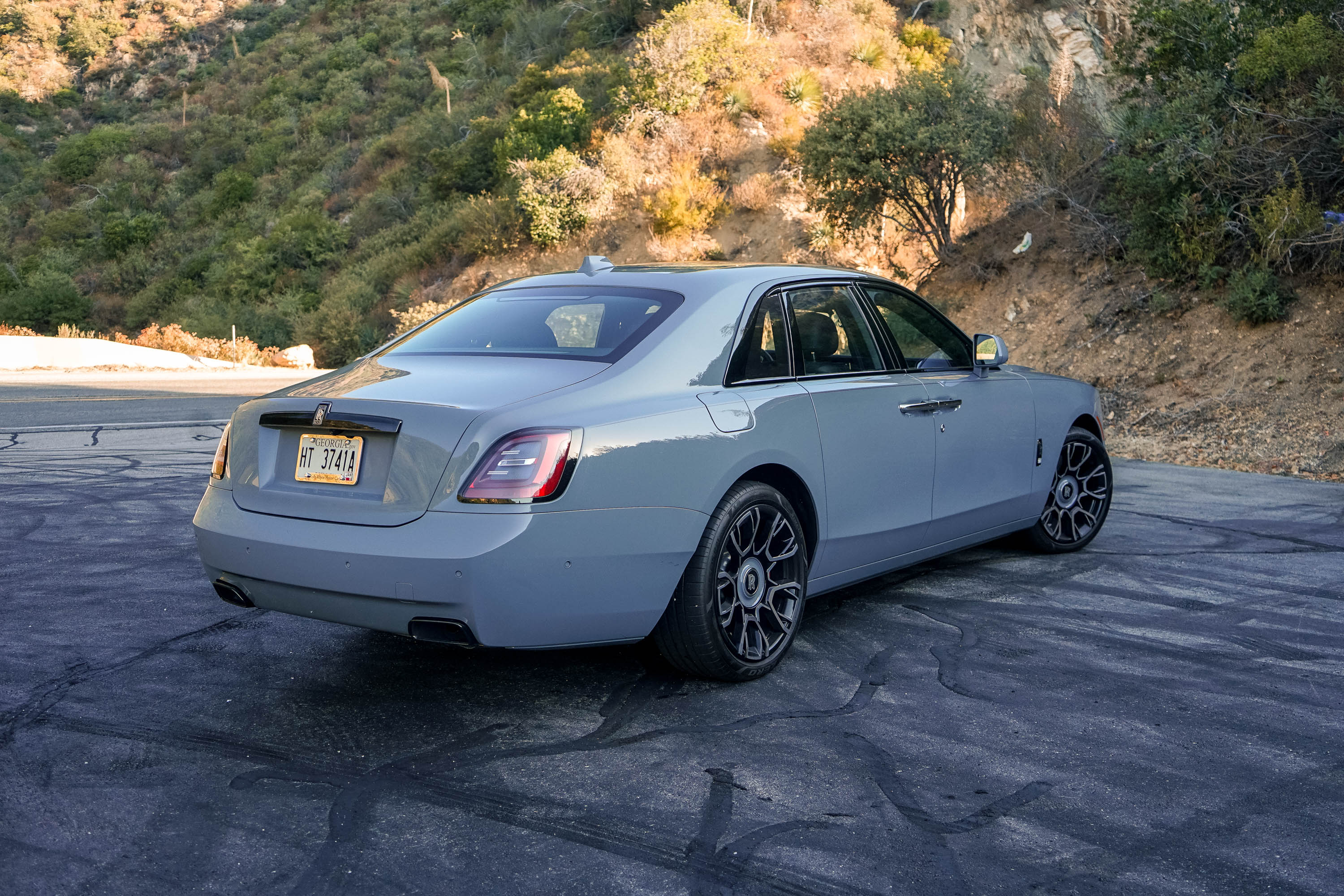 The rear end of the 2023 Rolls-Royce Black Badge Ghost