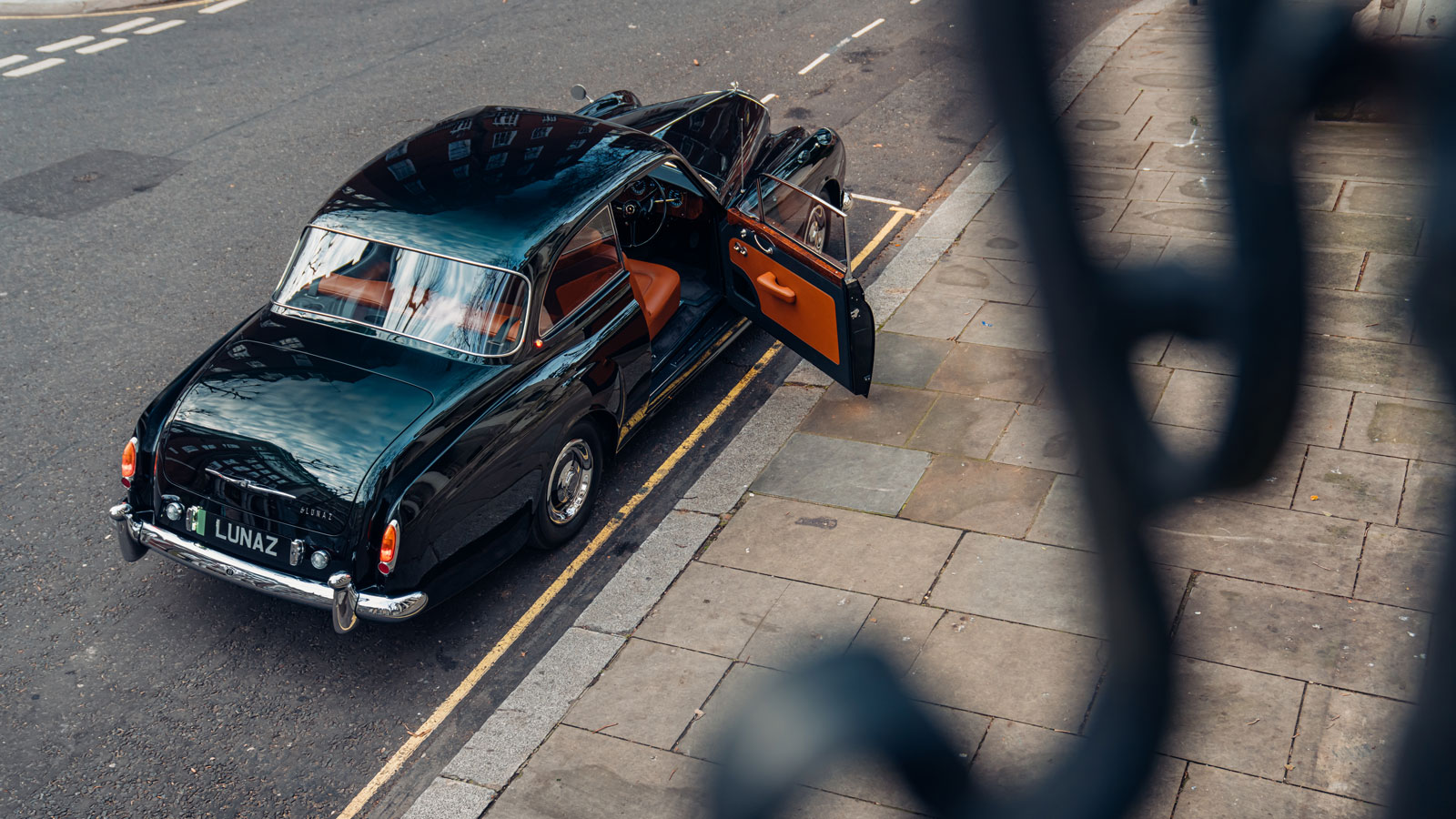 A photo of the Bentley EV with its door open. 