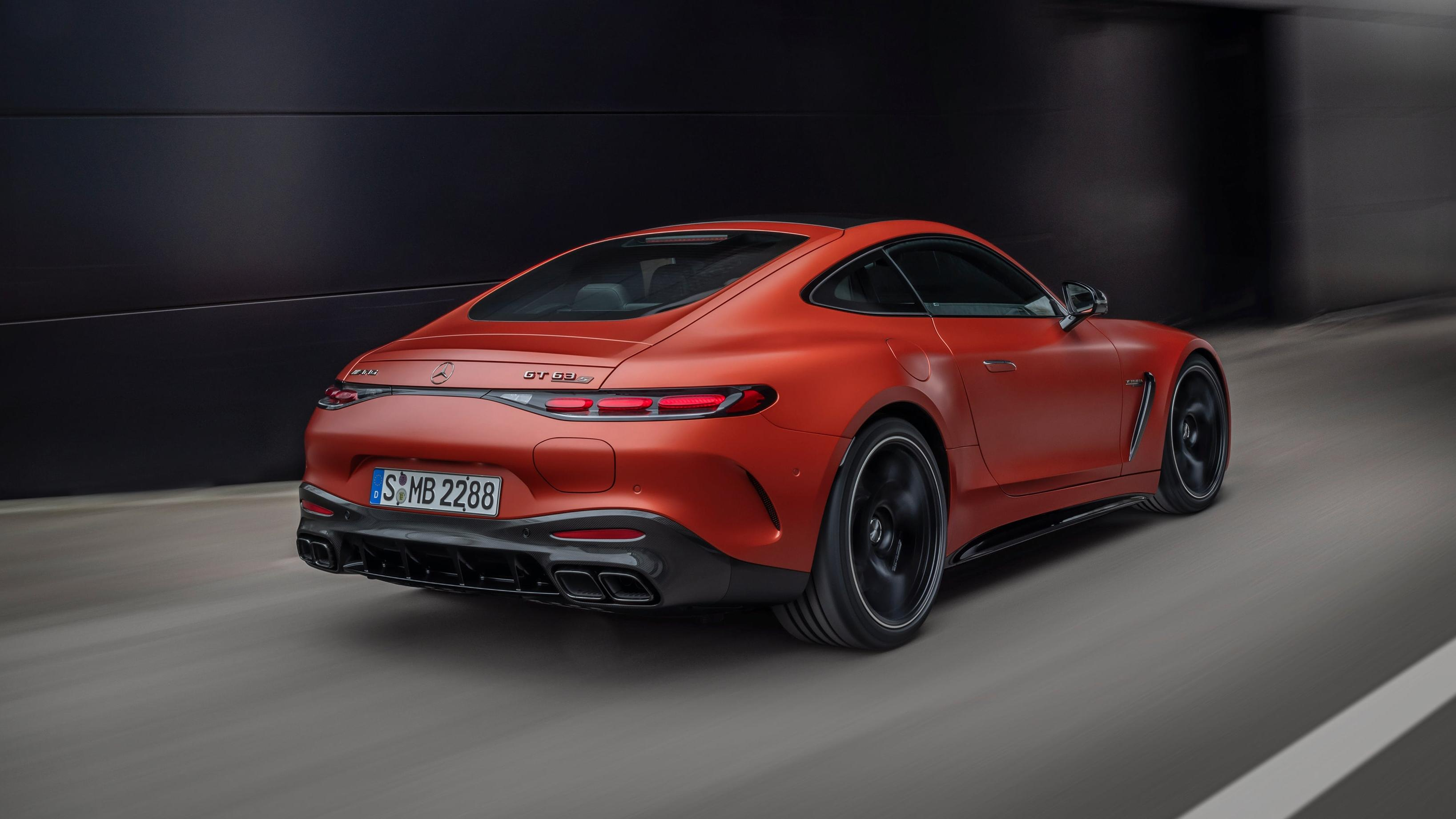 Rear 3/4 view of an orange Mercedes-AMG GT63 coupe