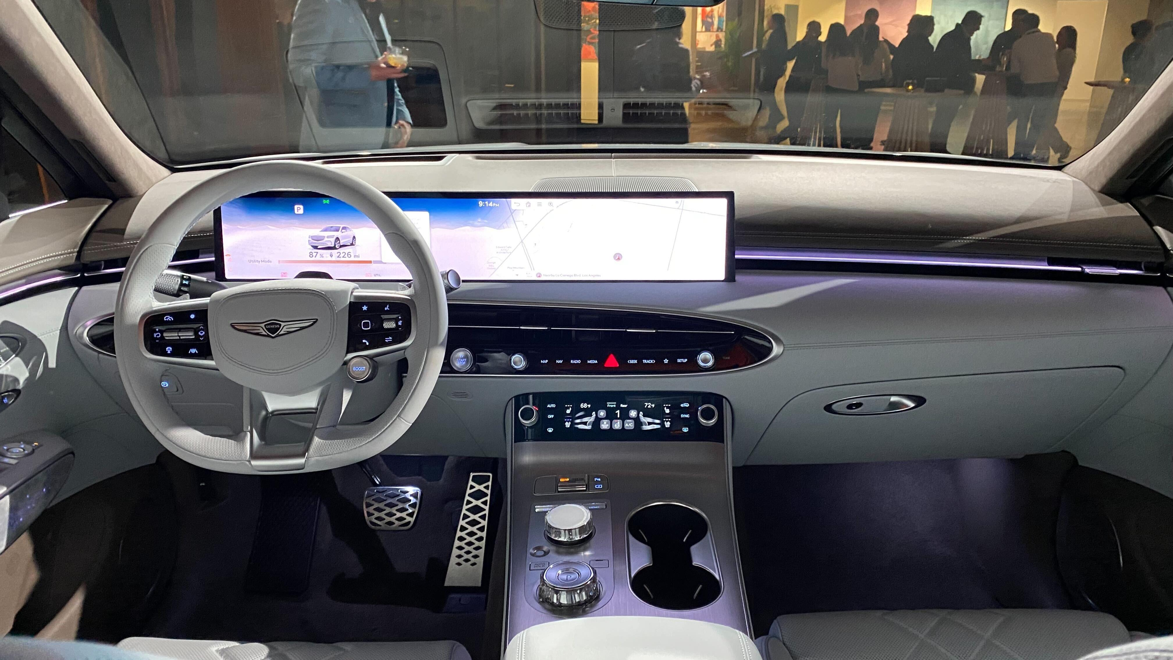 a photo of the dash board of the new GV70 electrified in white