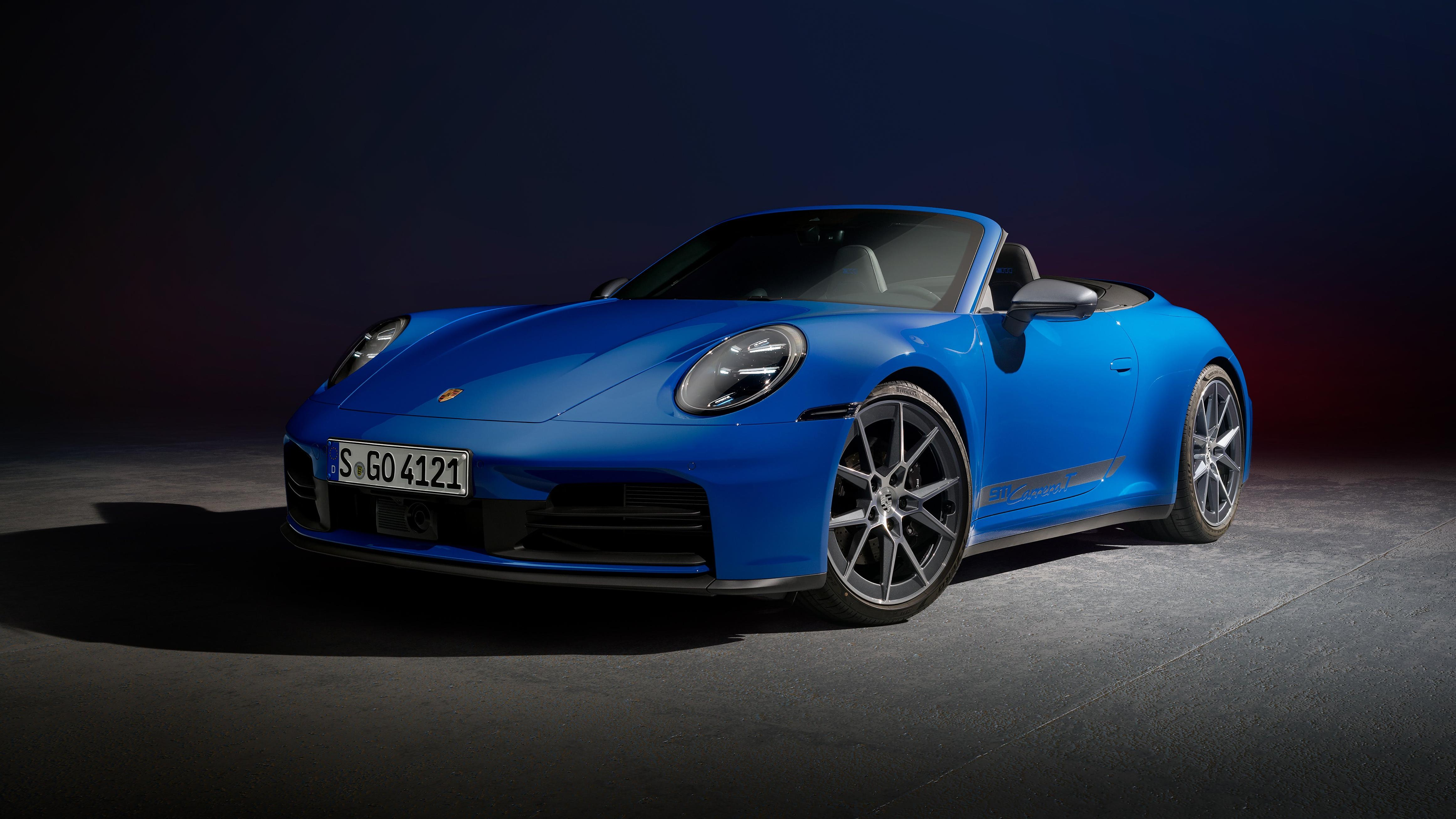 Front 3/4 view of a blue 2025 Porsche 911 Carrera T cabriolet