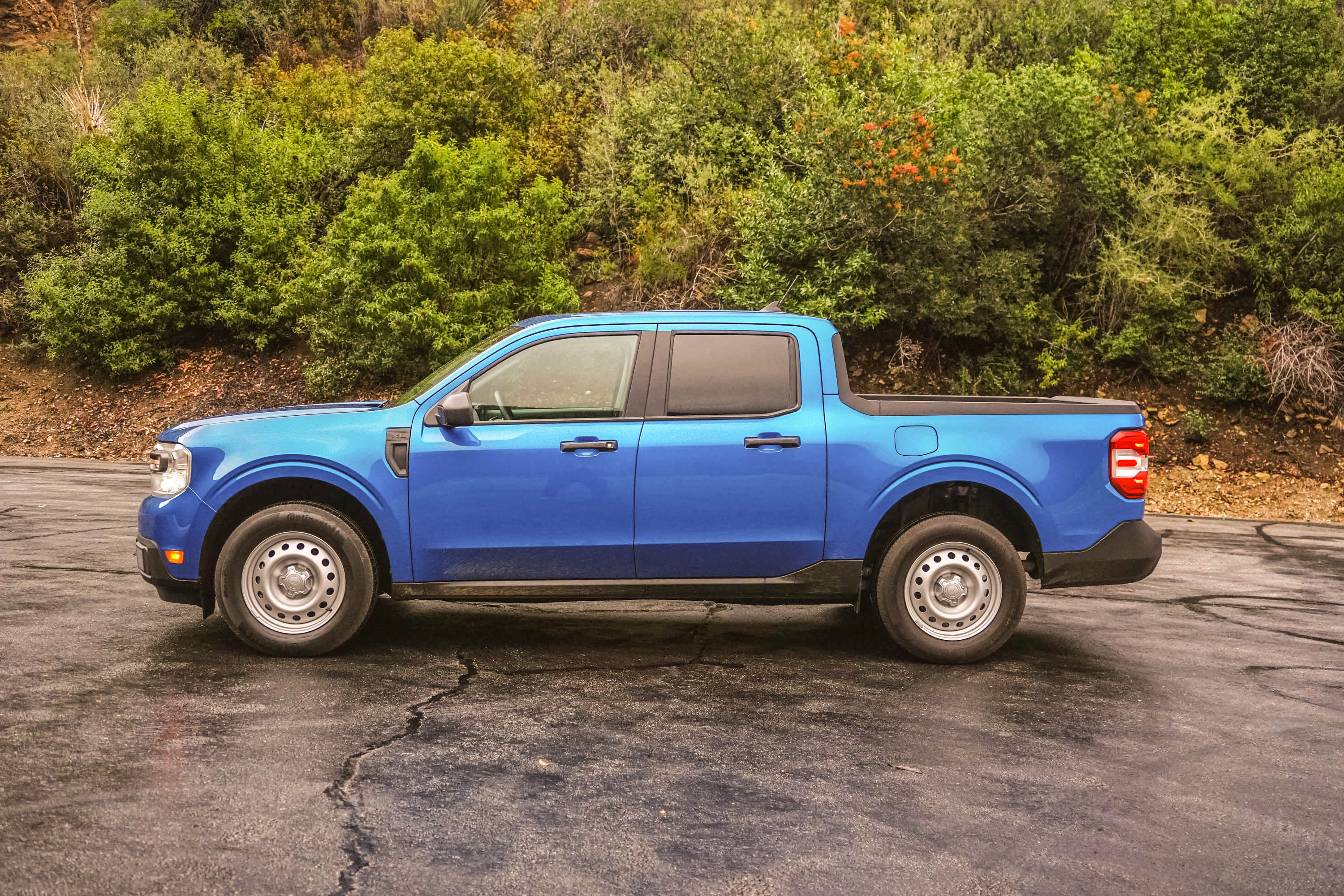 Side view of a blue 2023 Ford Maverick XL