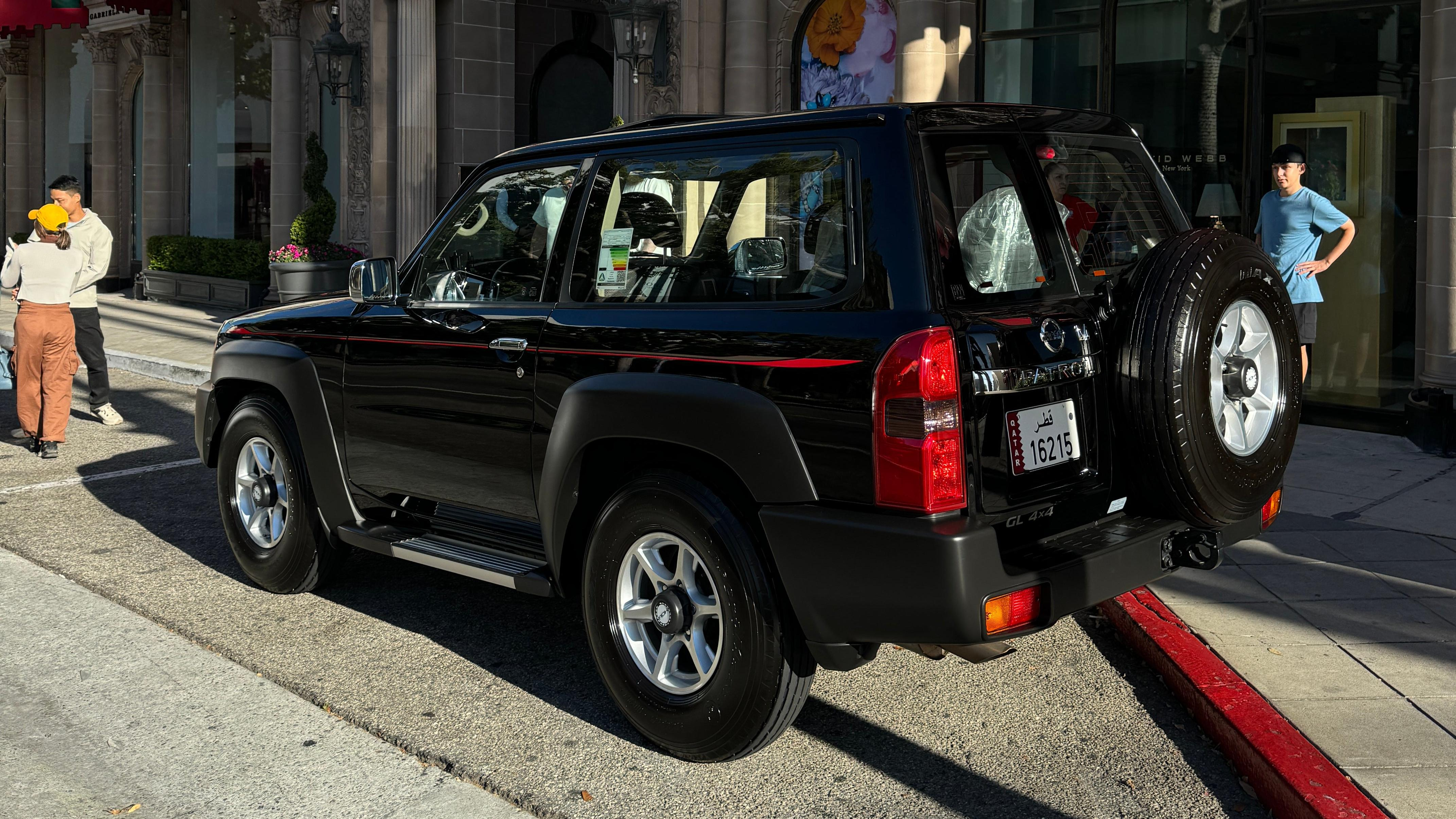 Rear 3/4 view of a black Nissan Patrol