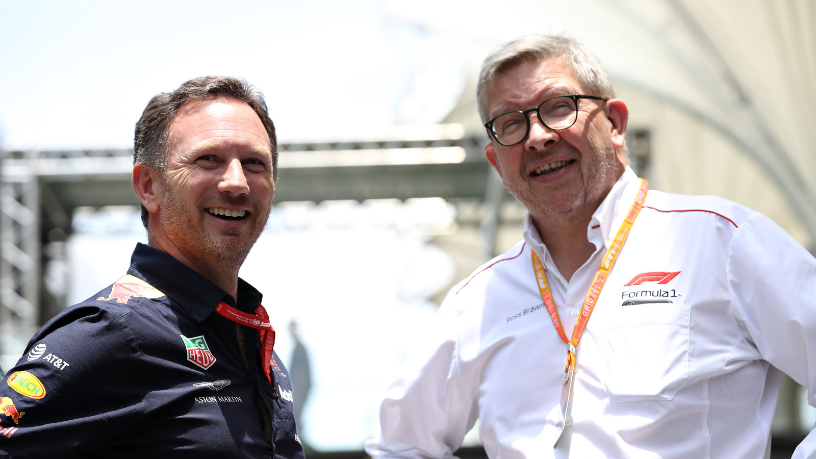 Christian Horner and Ross Brawn smiling at a Grand Prix event 