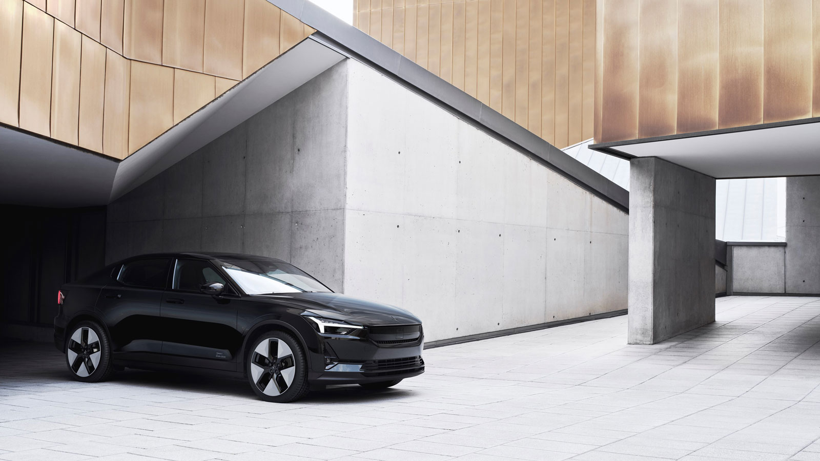 A photo of a black Polestar 2 EV. 