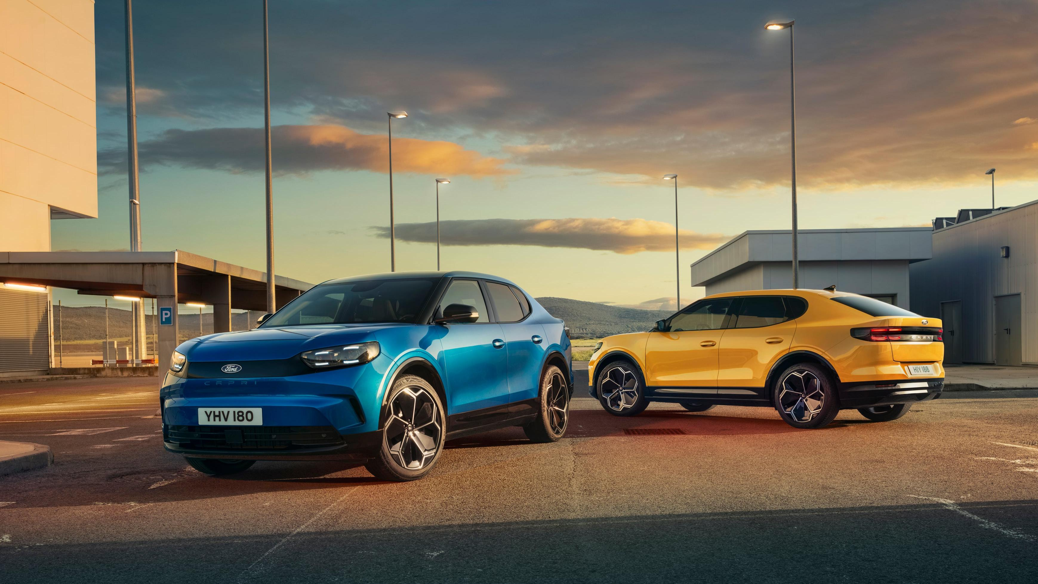 A blue Ford Capri EV next to a yellow Ford Capri EV