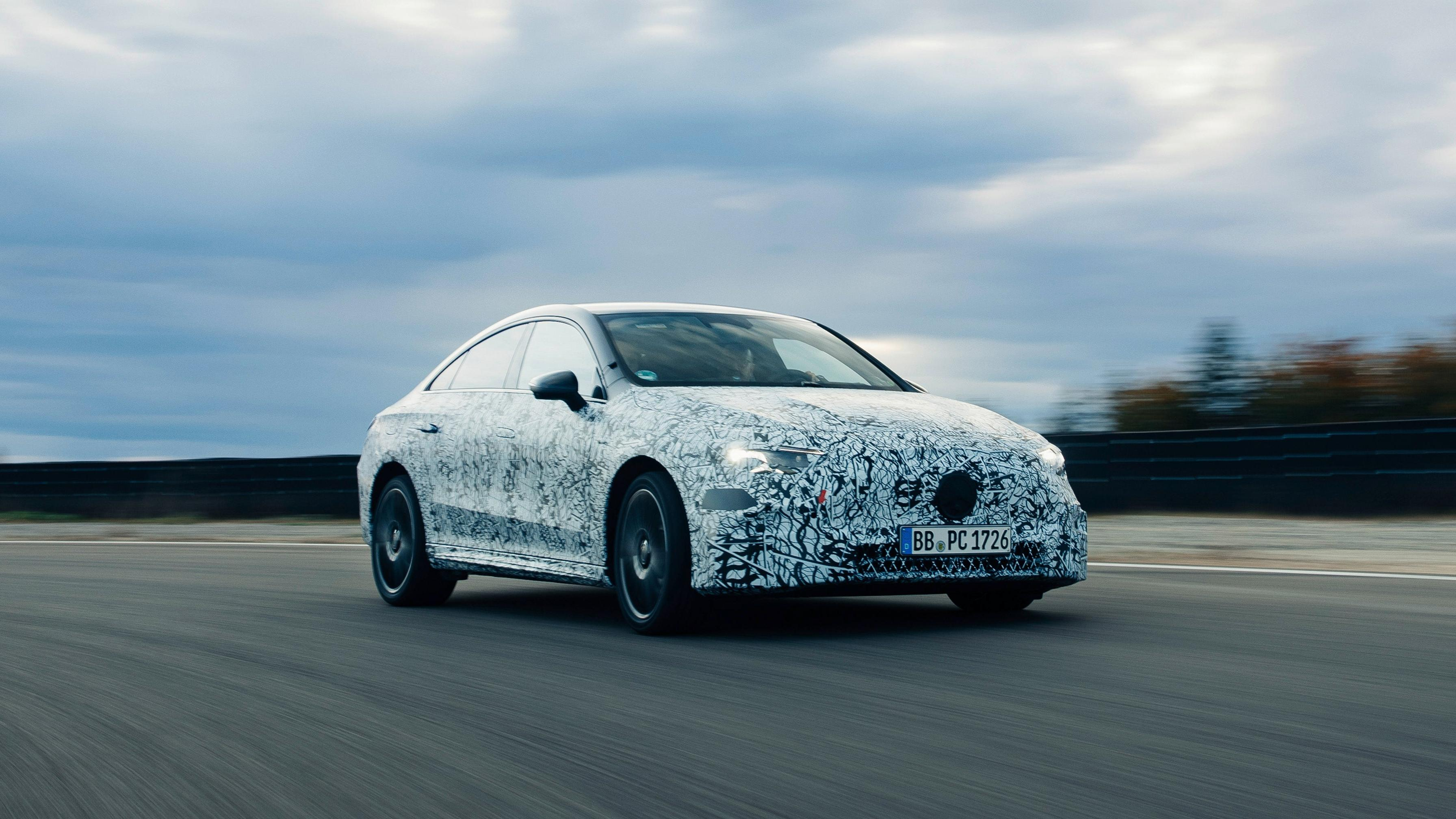 Front 3/4 view of a camouflaged Mercedes-Benz CLA