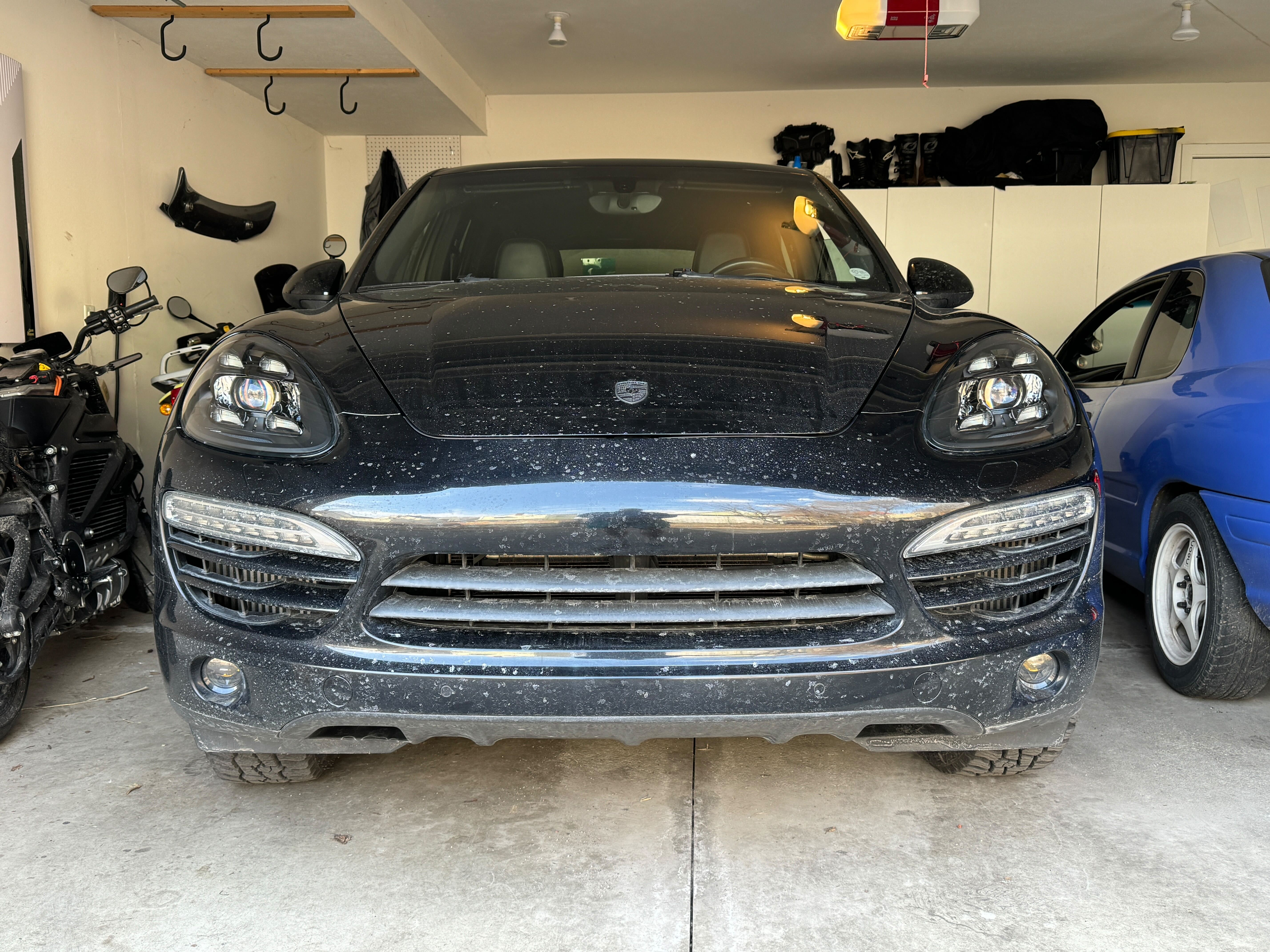 Front view of 2013 Porsche Cayenne Diesel with Lightwerks headlights and Rennline fog lights - chrome DRL