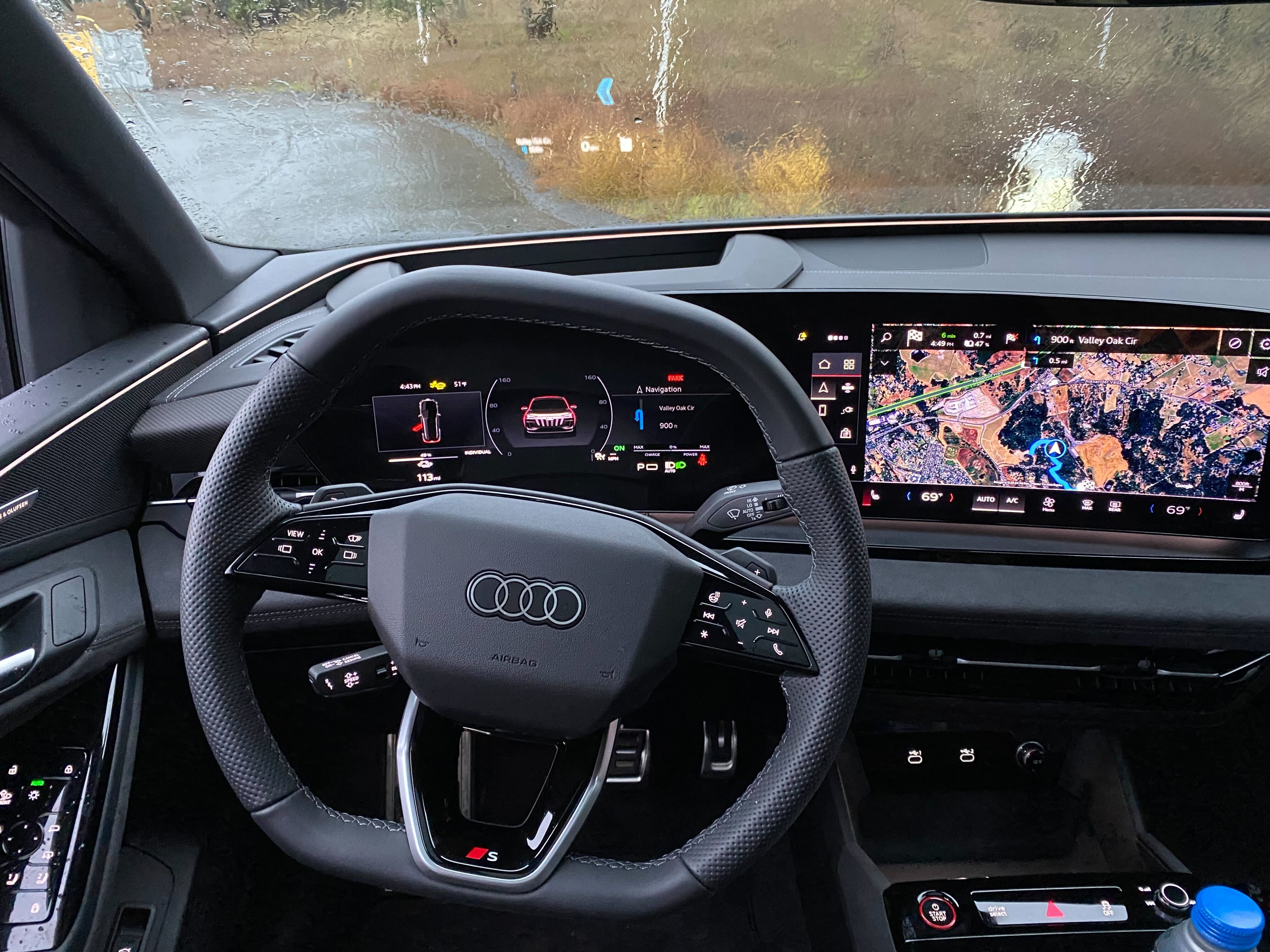 A close-up of the steering wheel and driver's view of the SQ6