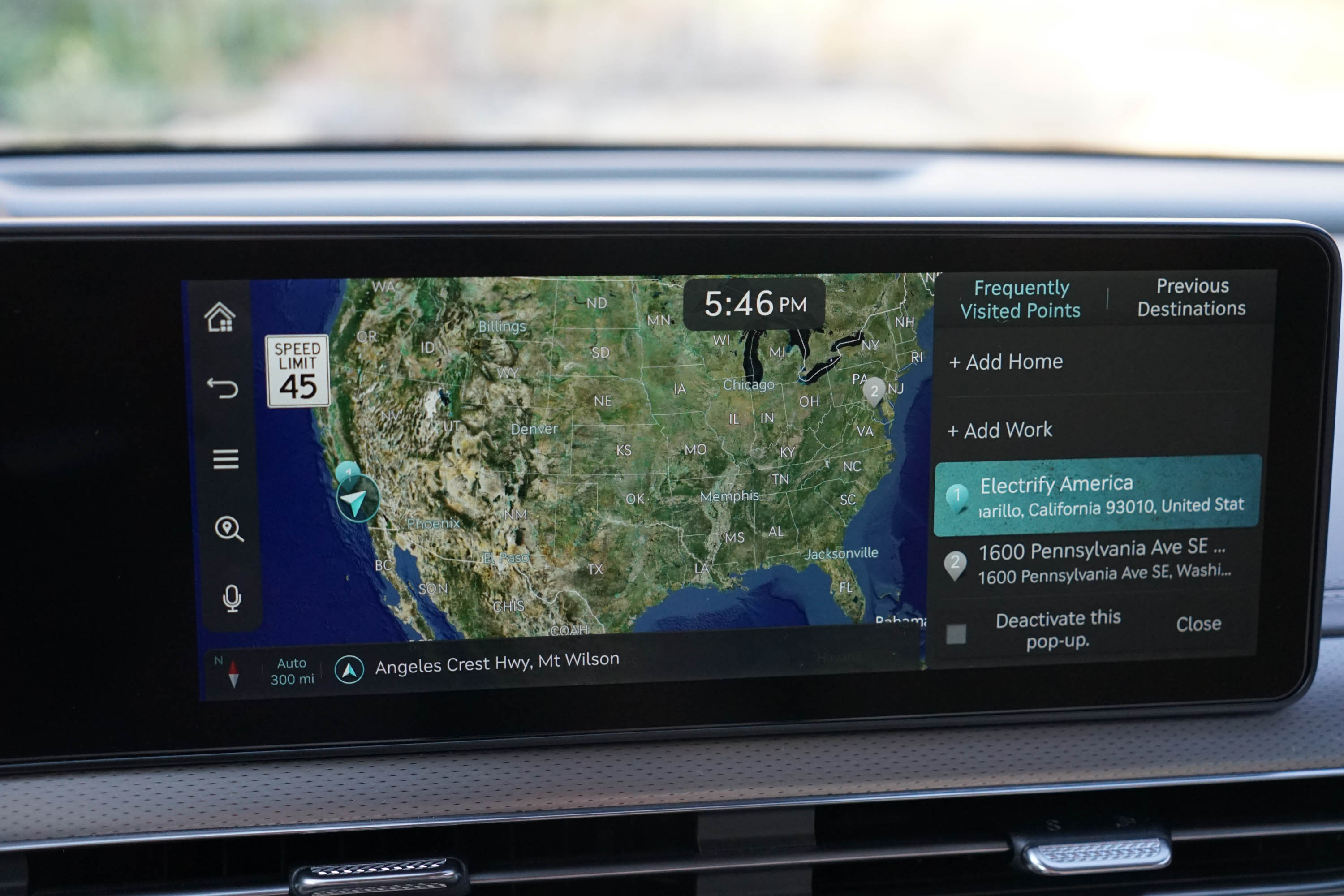 The infotainment screen for the 2023 Genesis GV60 displays a map of the US.