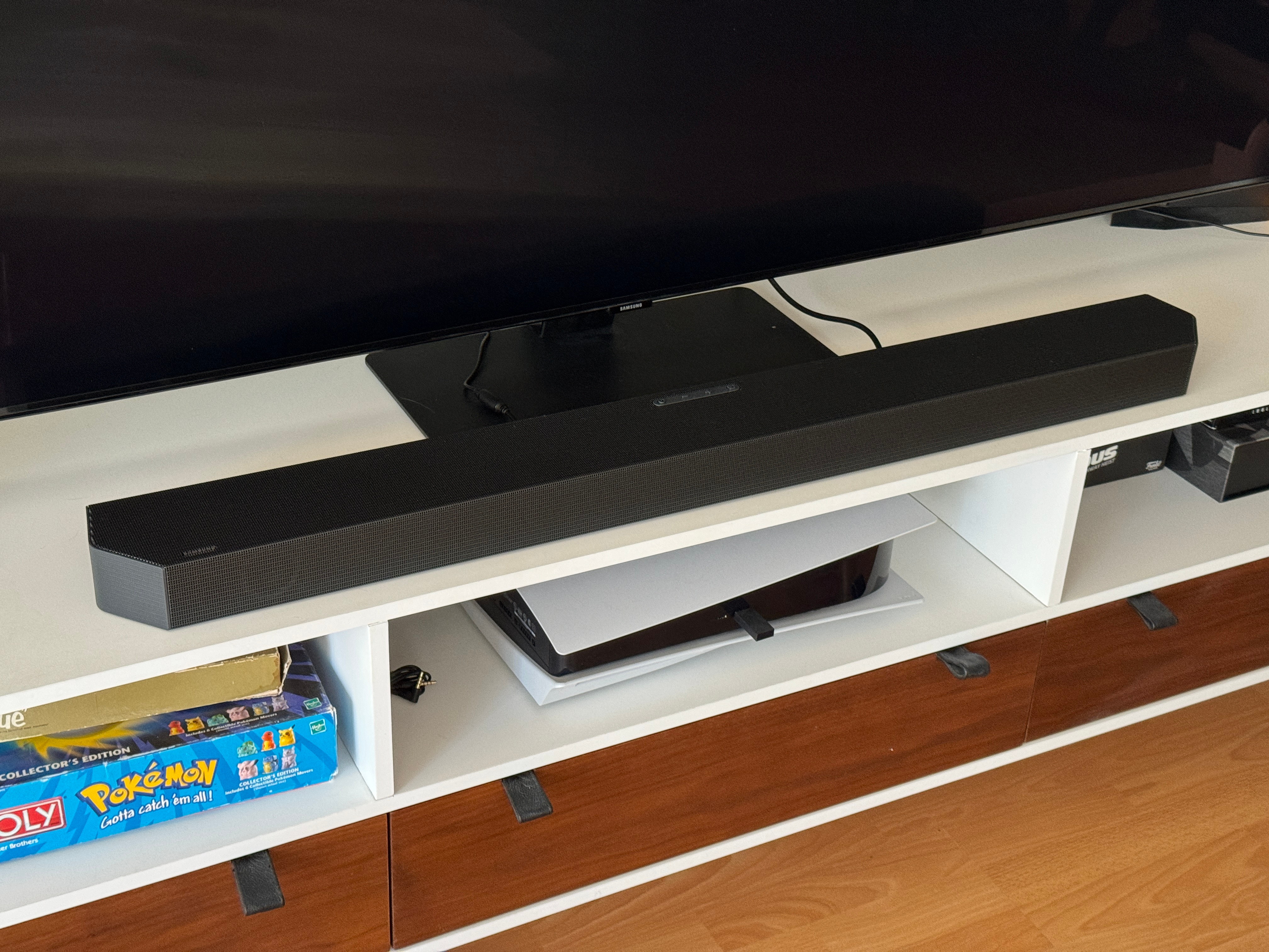 A Samsung soundbar on an entertainment center