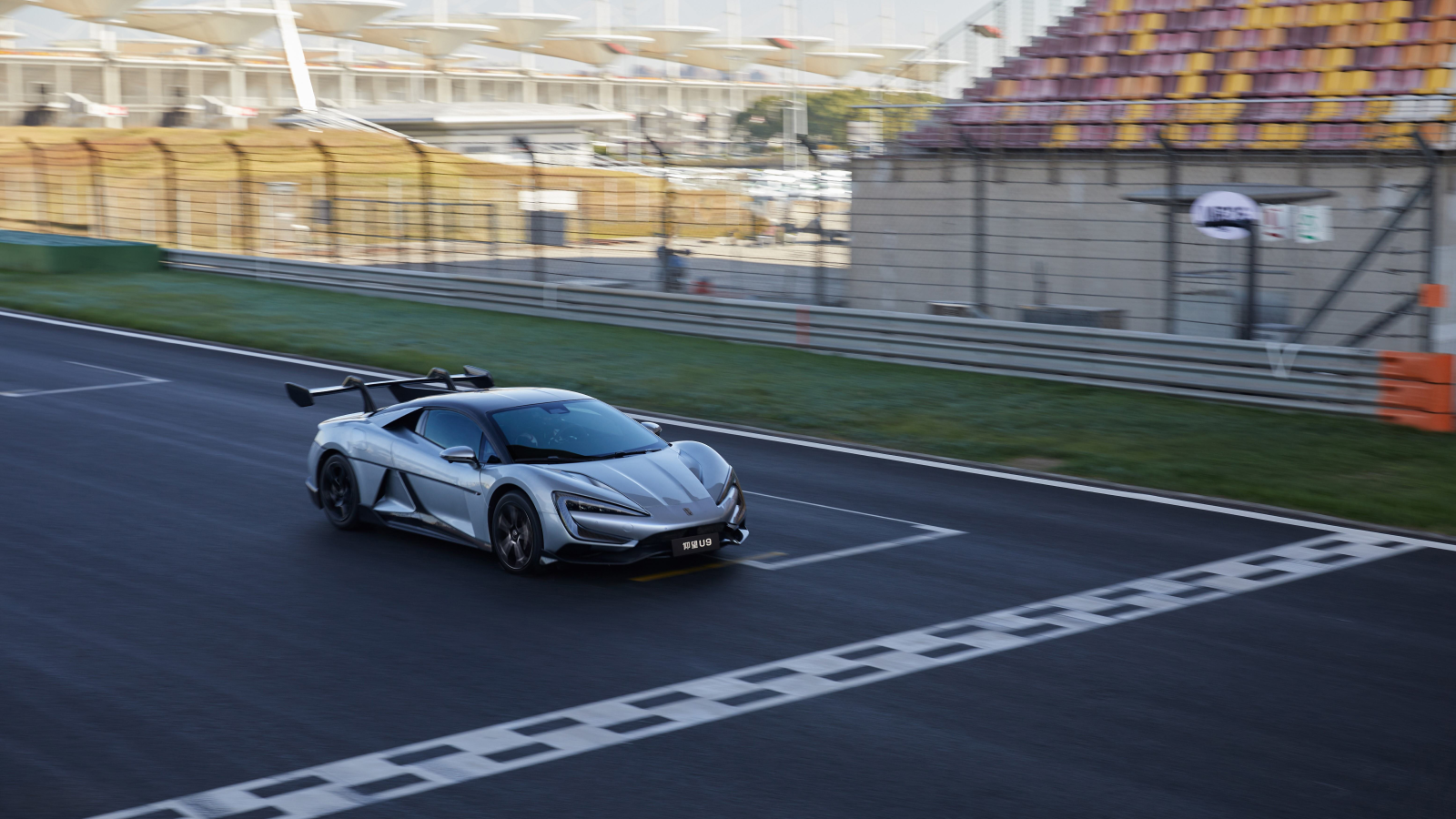 A render of the BYD electric supercar driving on a track. 