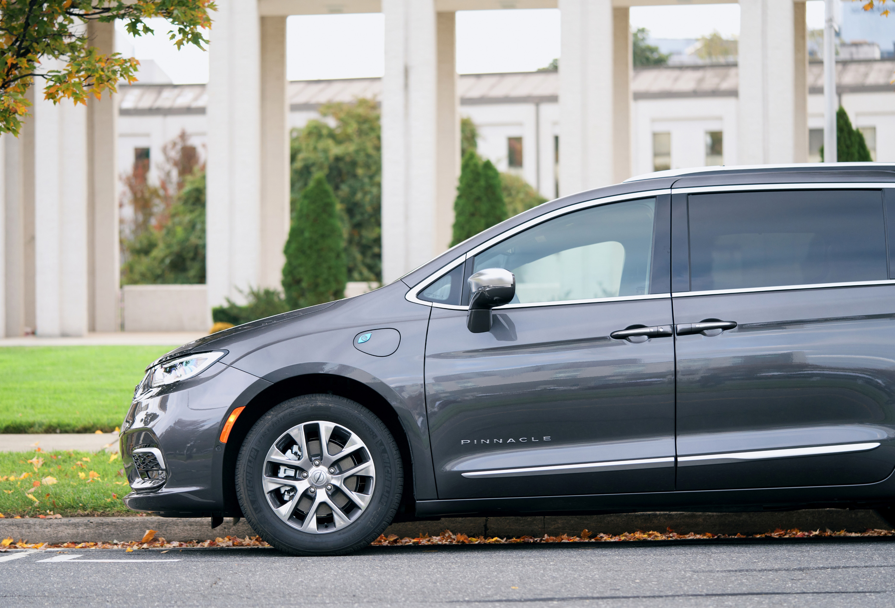 A Chrysler Pacifica PHEV parked on a street