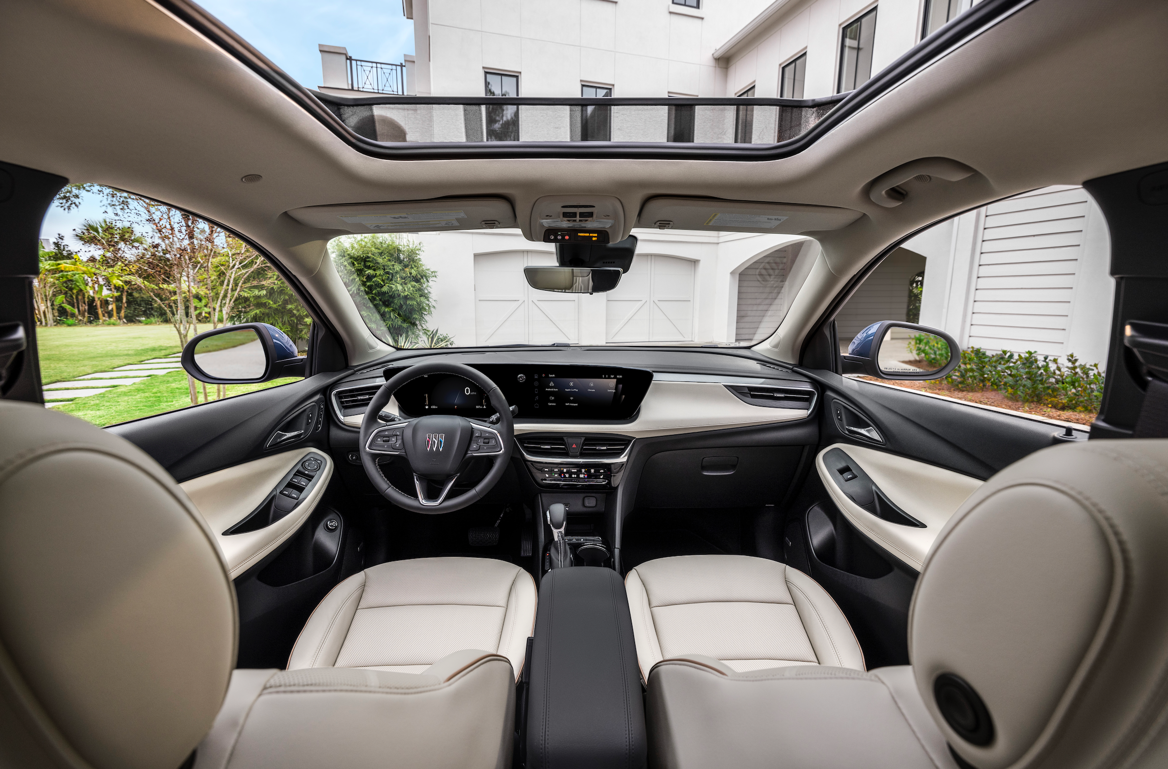 A blue 2024 Buick Encore GX Avenir.