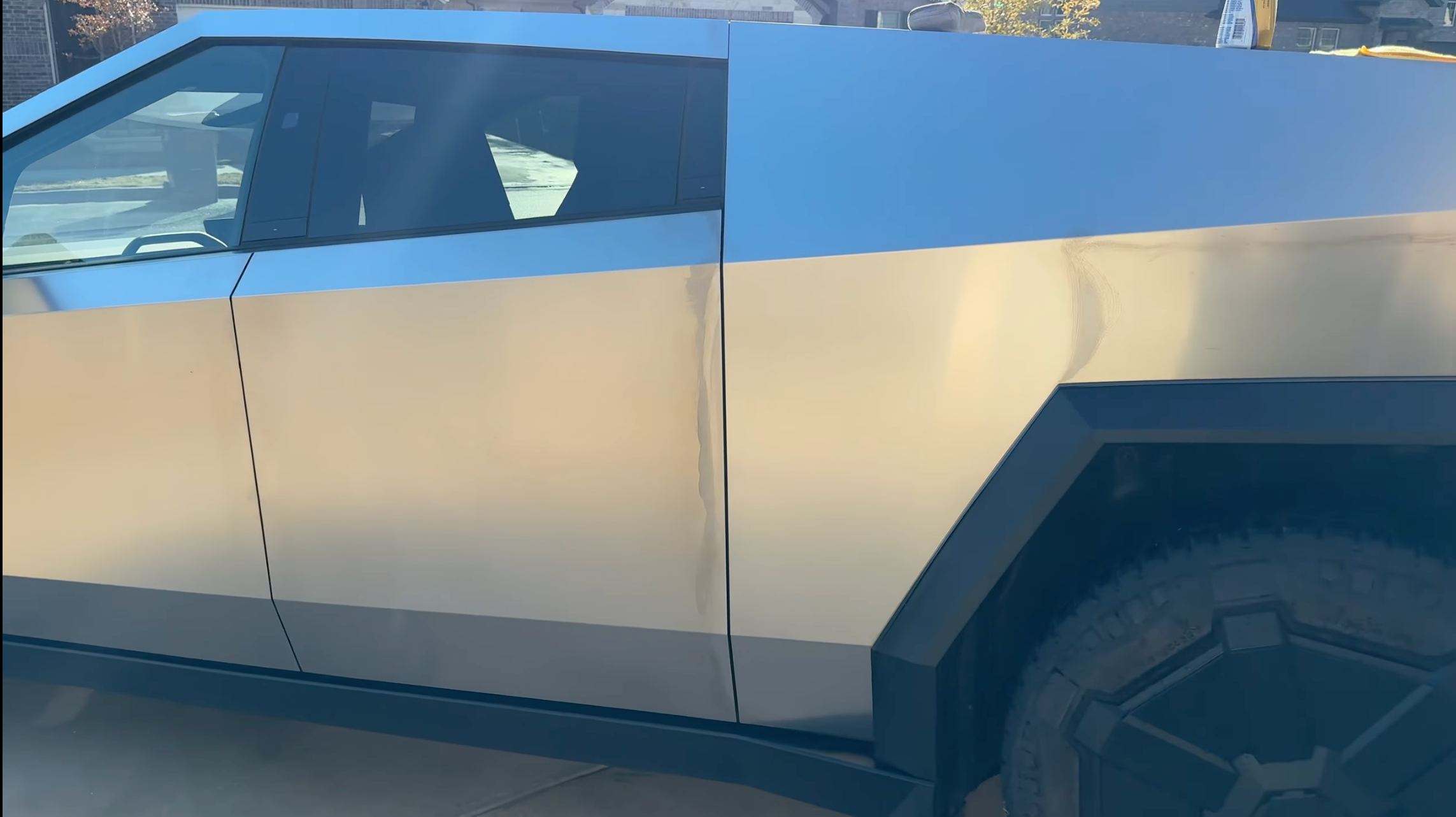 The shiny portion of the Cybertruck bed behind the rear door but in front of the wheel arch was just cleaned using Coleton's method and you can see how tarnished the rest of the body looks in comparison.