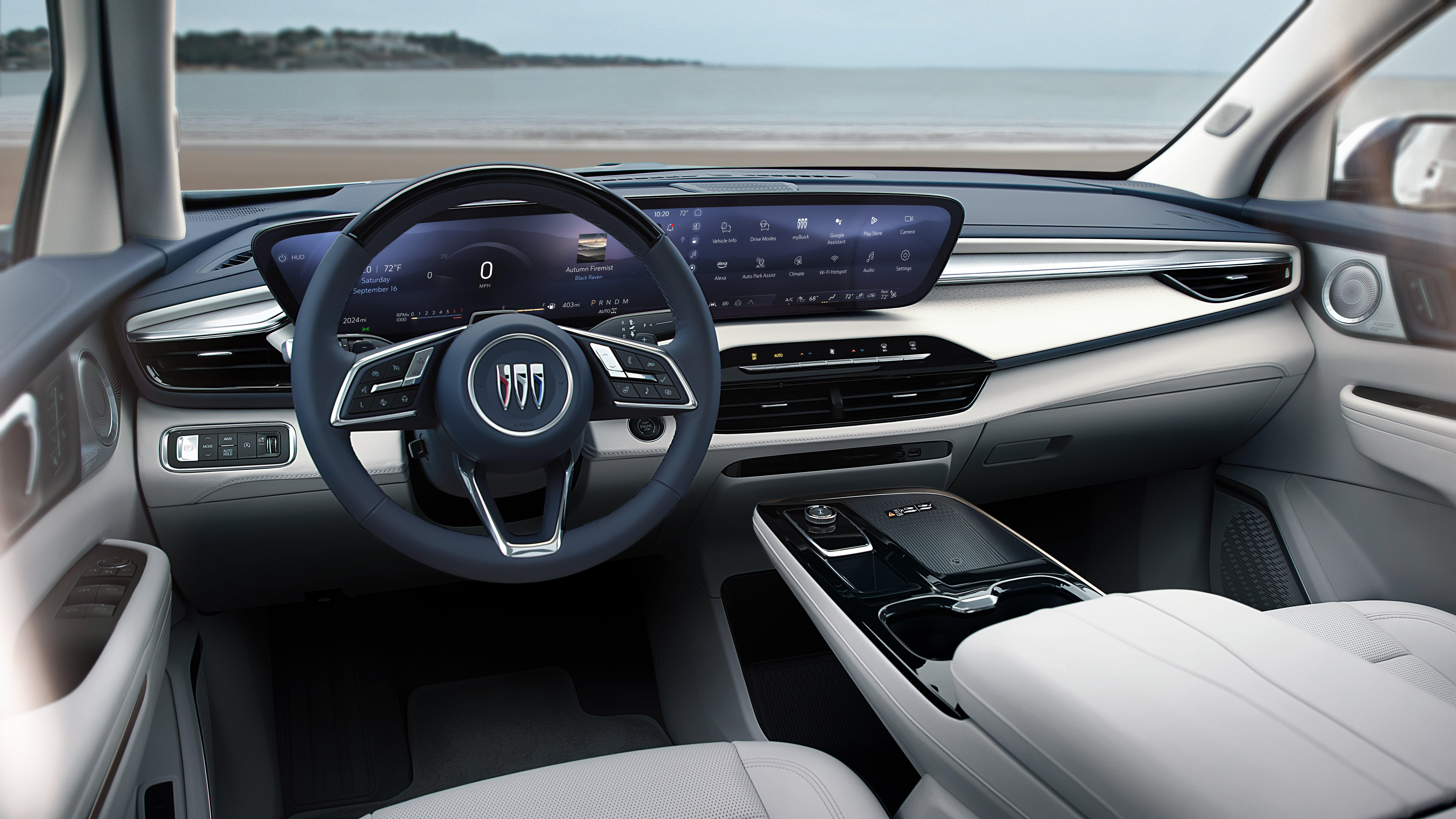 A photo of the Enclave's interior with light colored leather and blue accents 