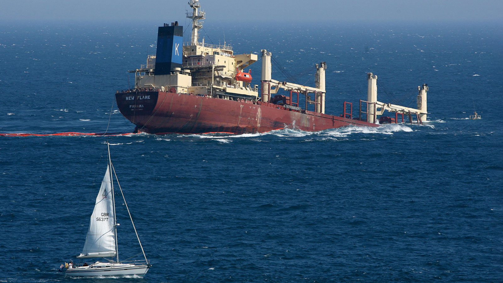 A photo of a huge ship sinking into the sea. 