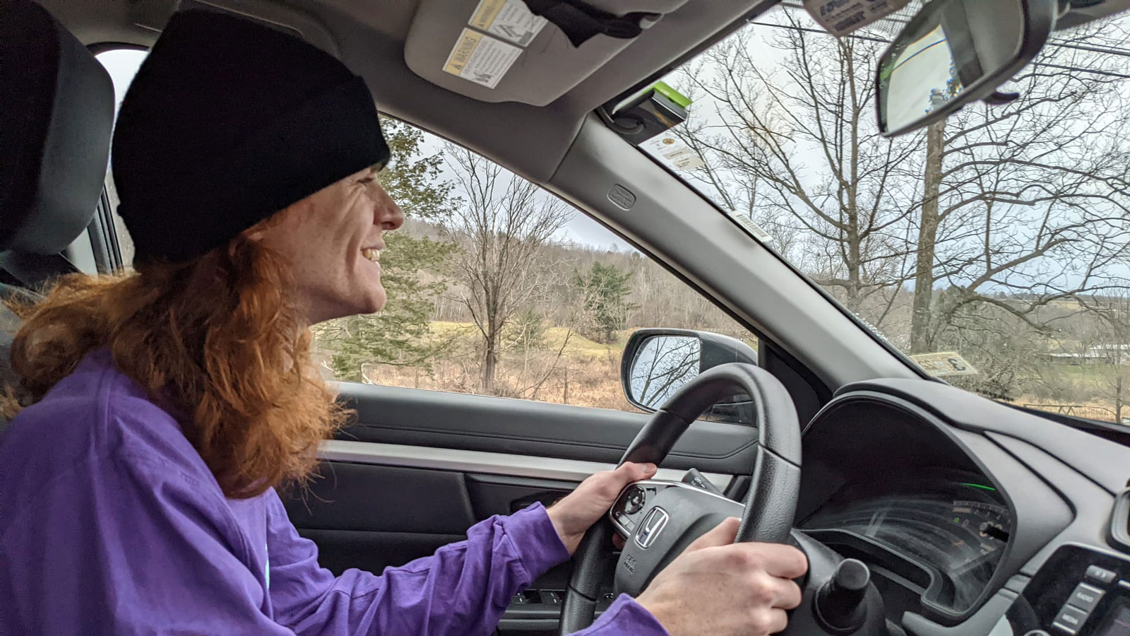 A photo of someone driving a Honda CR-V SUV