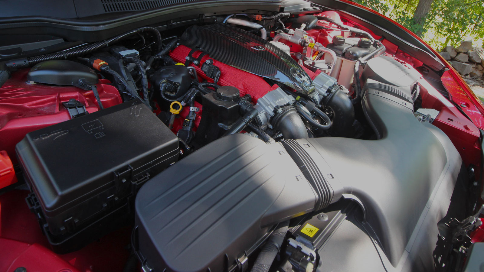 A photo of the V8 engine in the front of the Maserati Ghibli. 