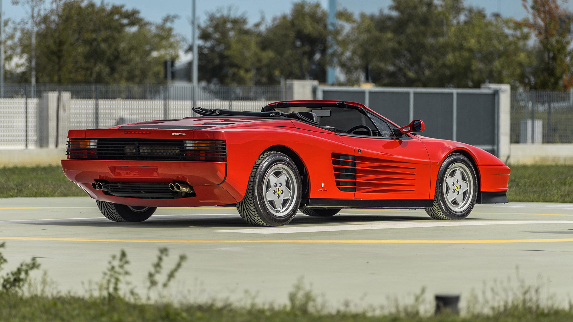 Rear quarter view of red Ferrari Testarossa Pininfarina Spider 