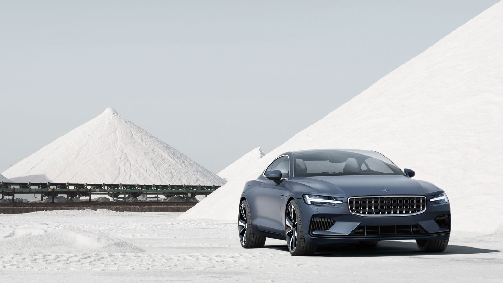 A photo of the Polestar 1 coupe parked at a salt mine. 