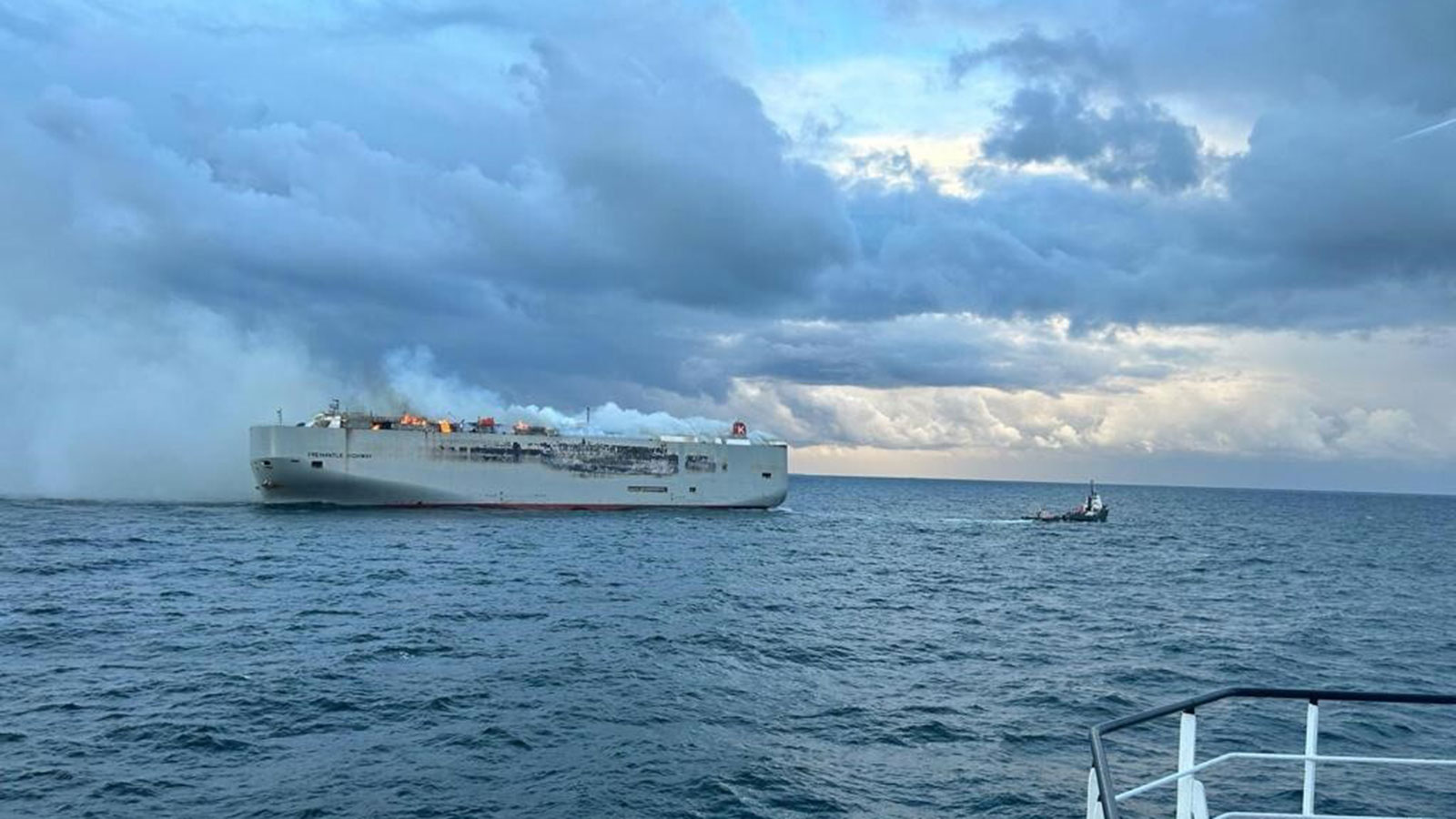 A photo of the smoking Fremantle Highway car carrying ship. 