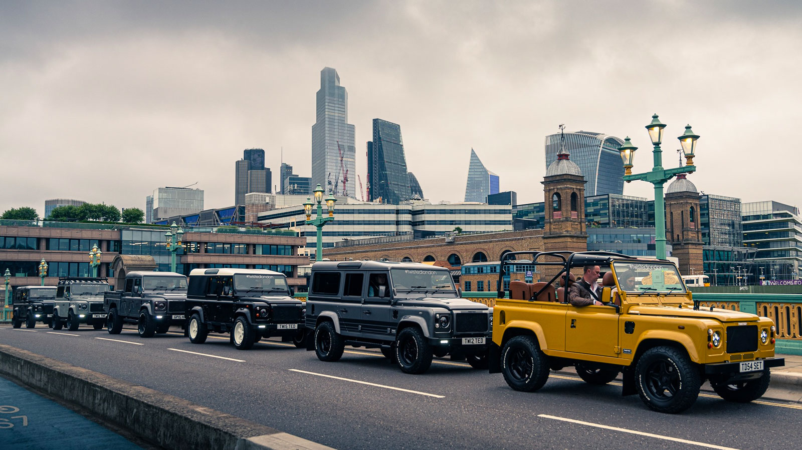 Six Land Rover Defenders line up on Southwark Bridge in London