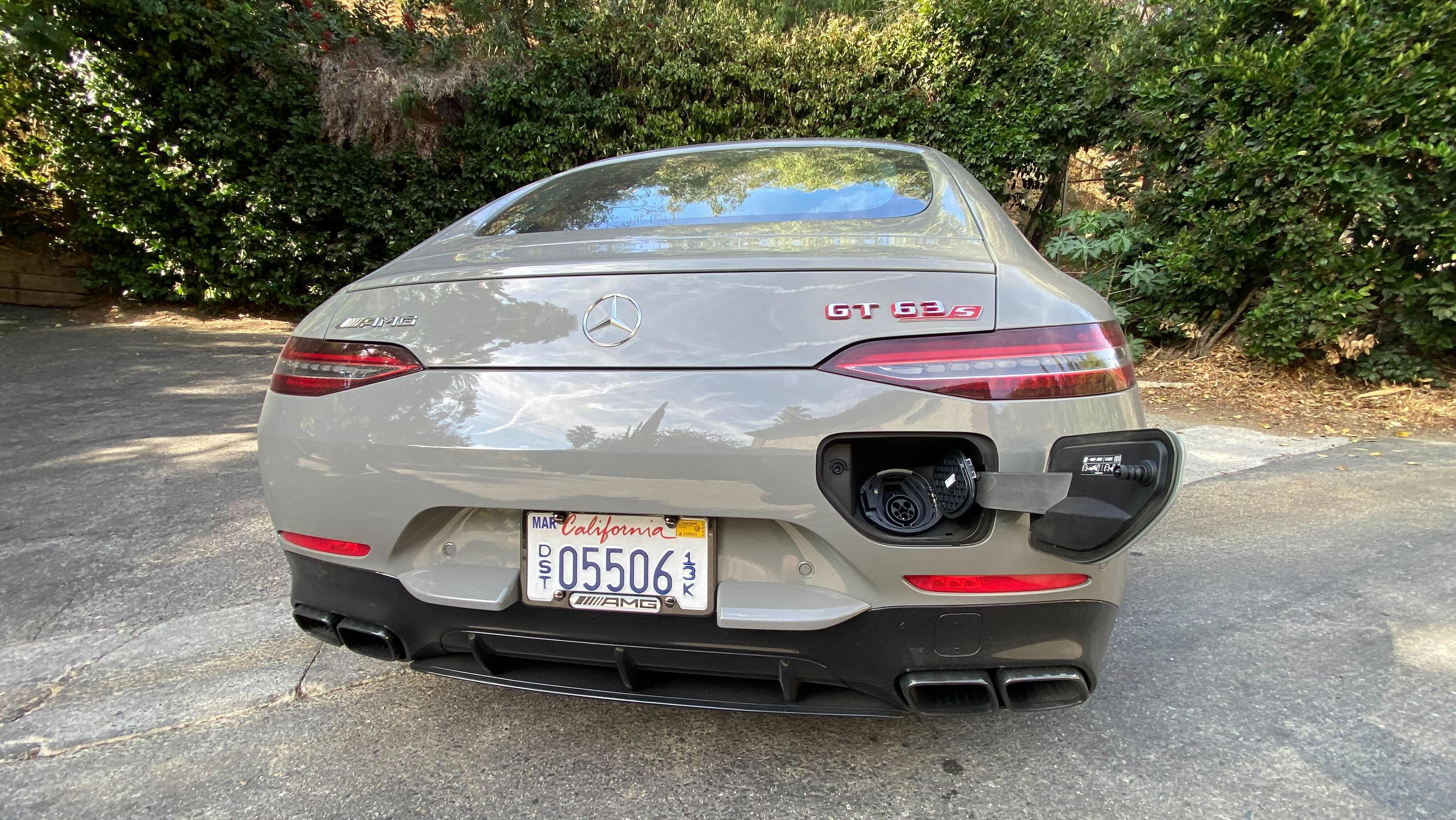 A rear shot of the AMG GT63 Hybrid with the charge port open on the rear bumper