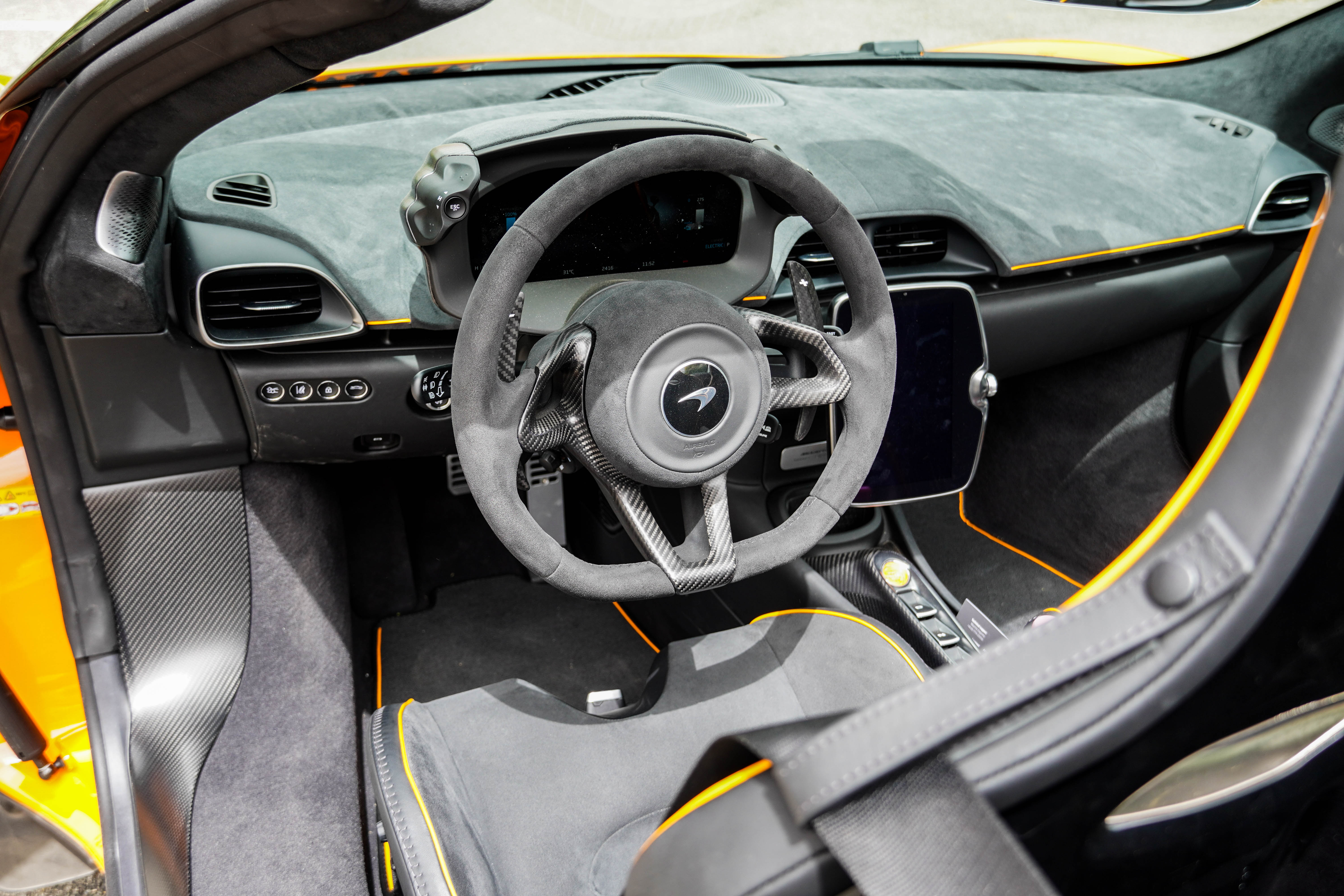 Interior of an orange McLaren Artura Spider