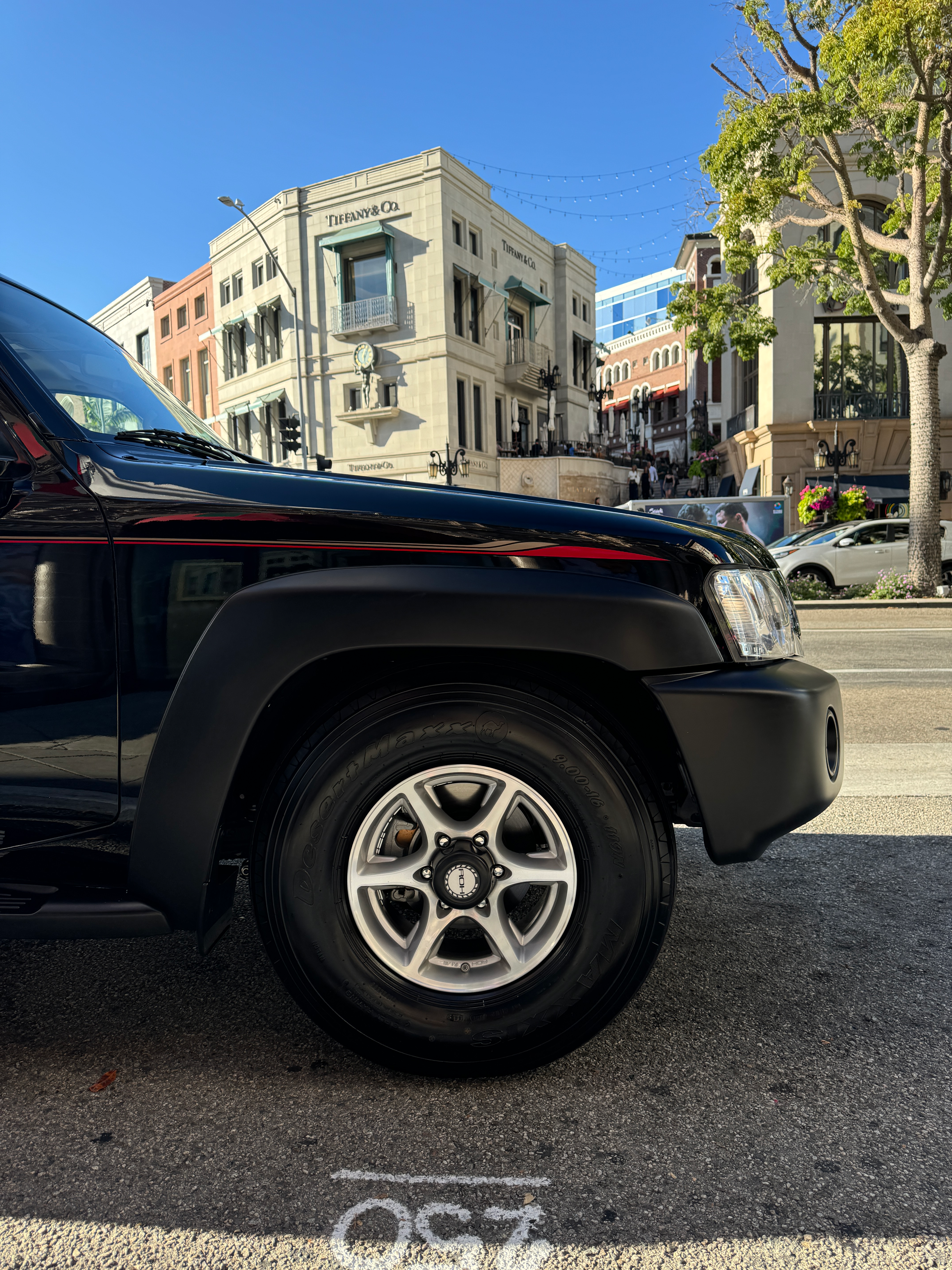 Front wheel of a black Nissan Patrol