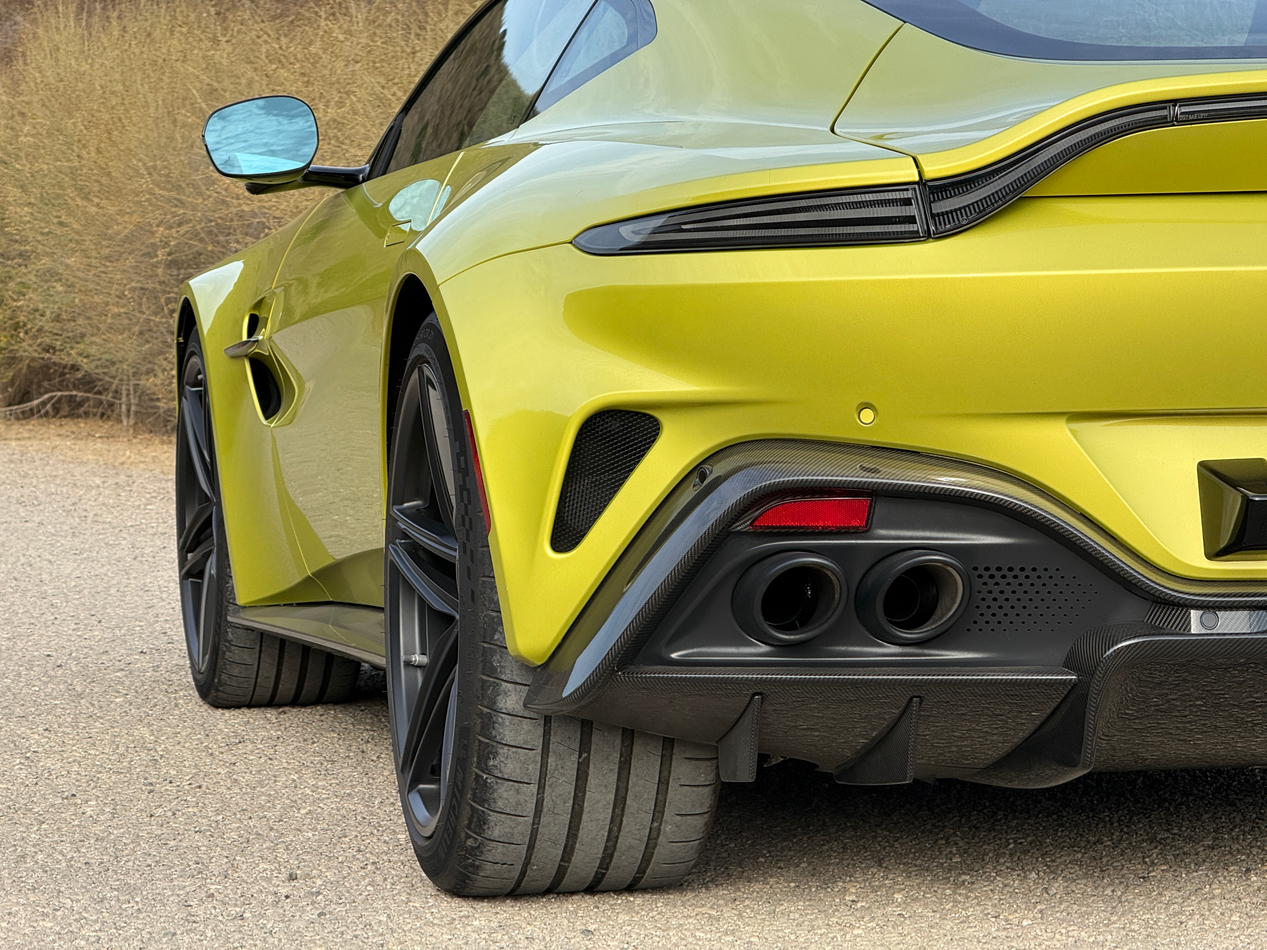 Rear end detail of a yellow 2025 Aston Martin Vantage