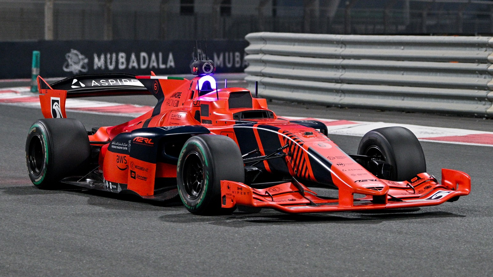 A photo of a self-driving race car on track. 