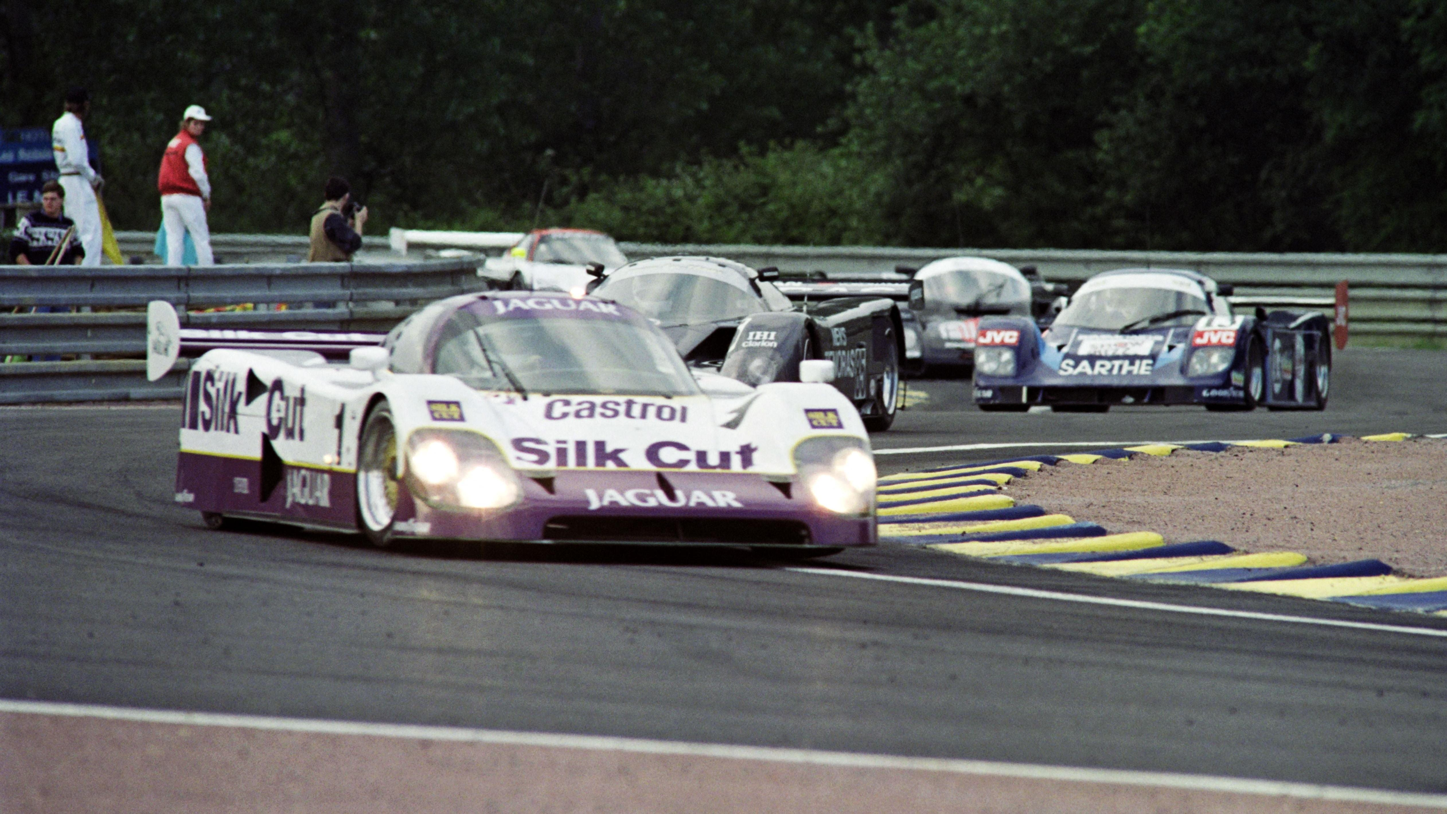 A group of cars pass through the new chicane Nissan set up on the famous Mulsanne Straight on June 14, 1990 in Le Mans during the second practice session of the 58th edition of the 24 hours of Le Mans. 